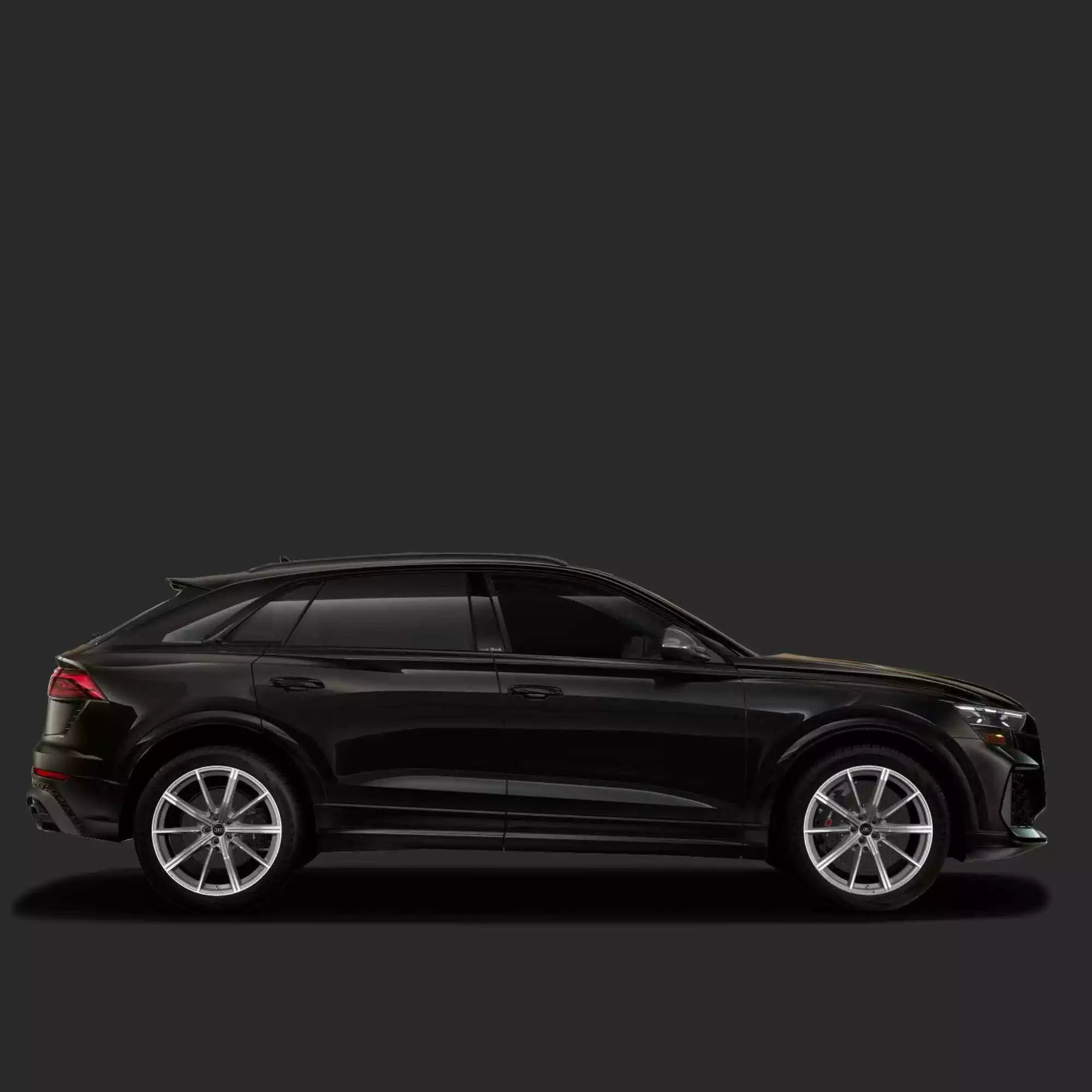 Black SUV on a dark gray background