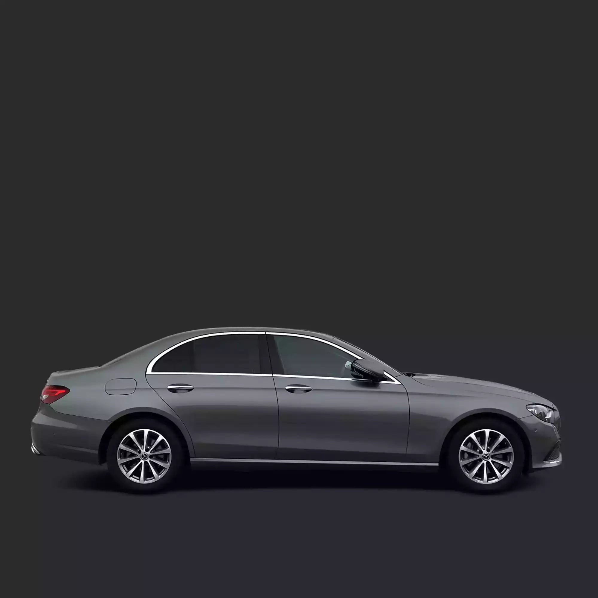 Side view of a gray car on a black background