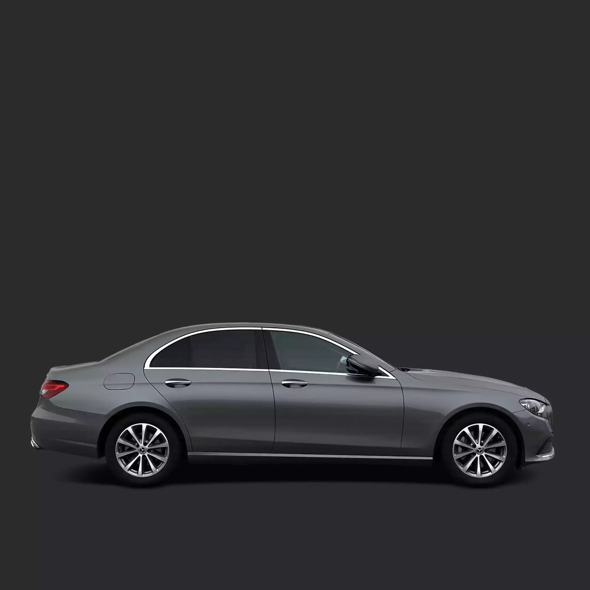 Side view of a gray car on a black background