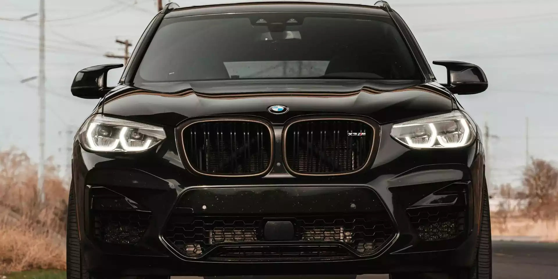 Black BMW SUV with a blurred background