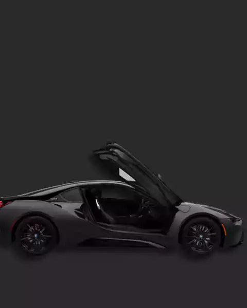 Black sports car with open door on a dark background
