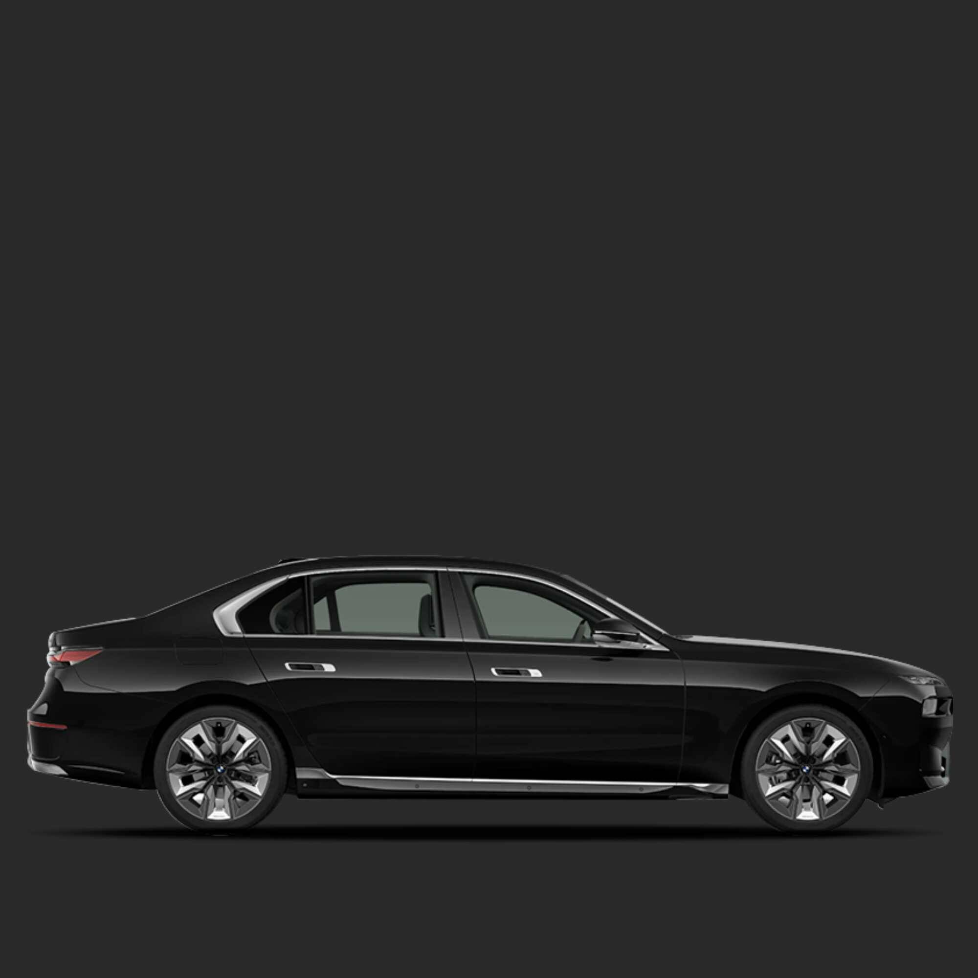 Side view of a black car on a dark gray background