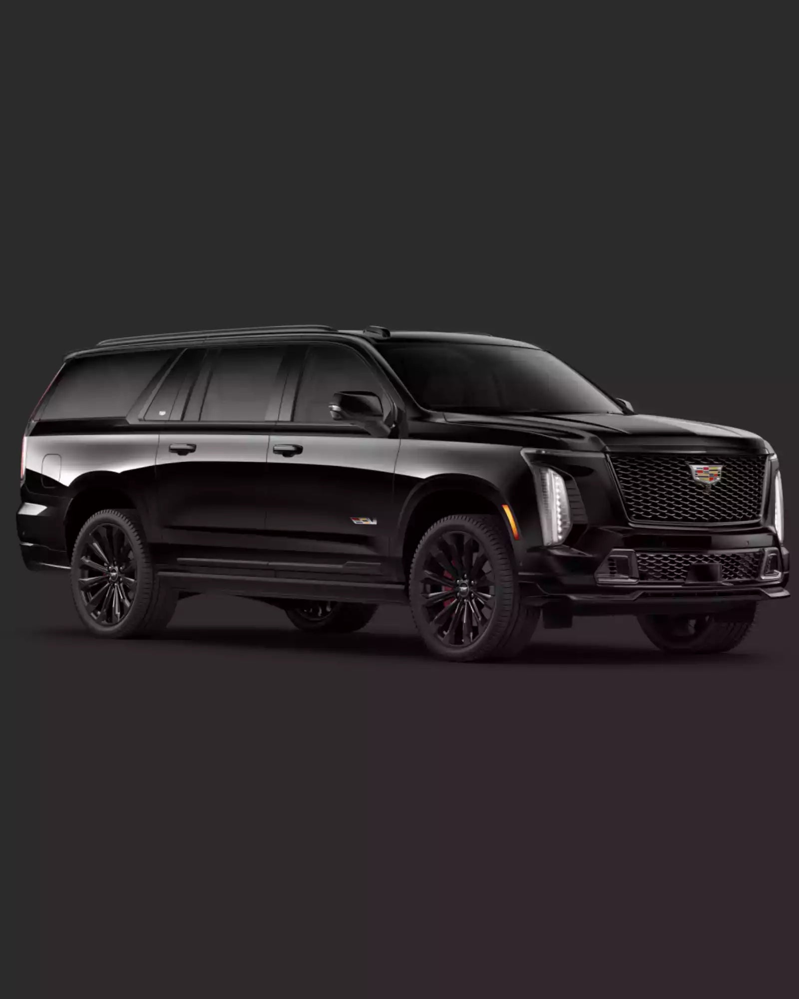 Black Cadillac SUV on a dark background