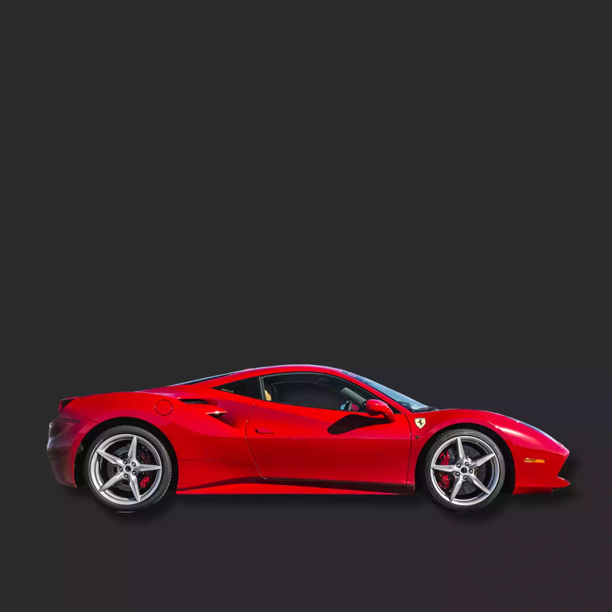 Red sports car on a black background