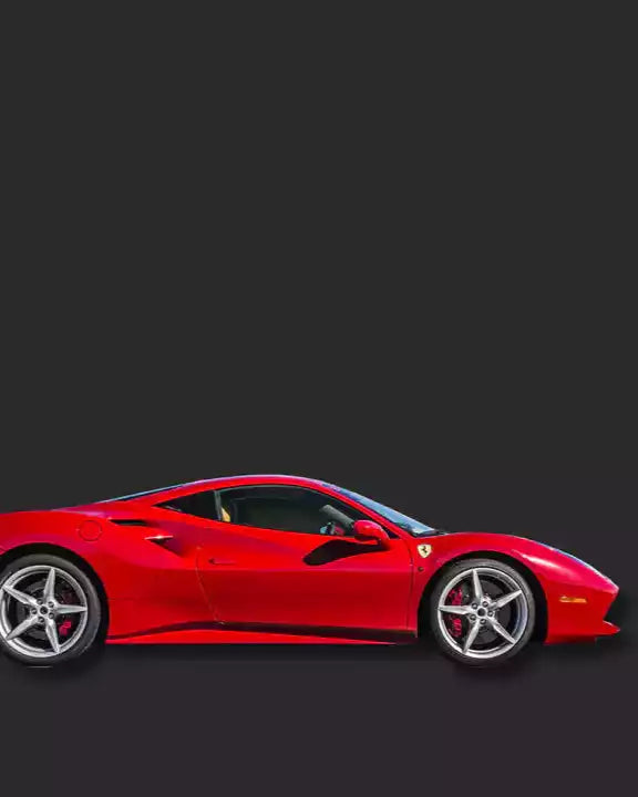 Red sports car on a black background