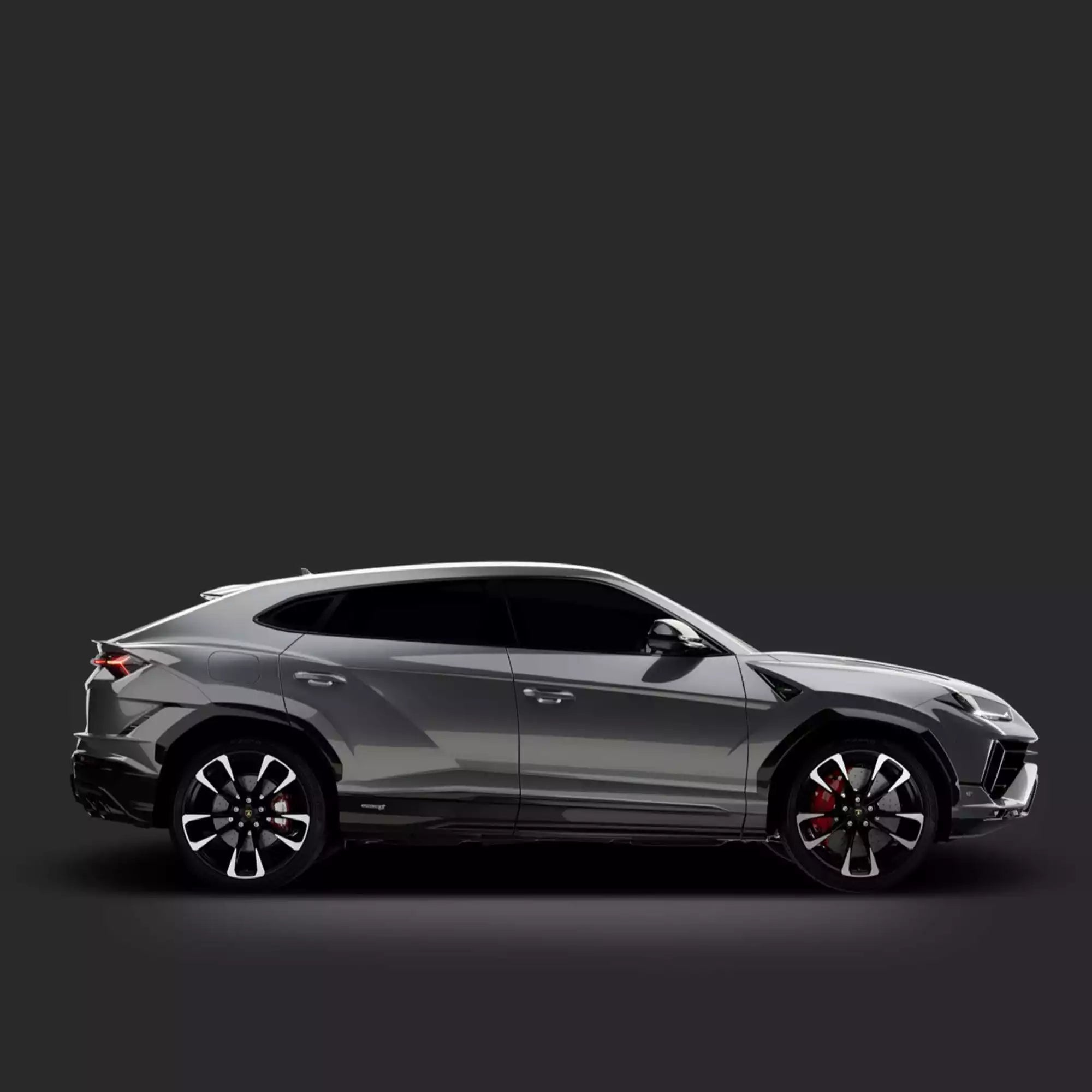 Side view of a luxury SUV on a dark background