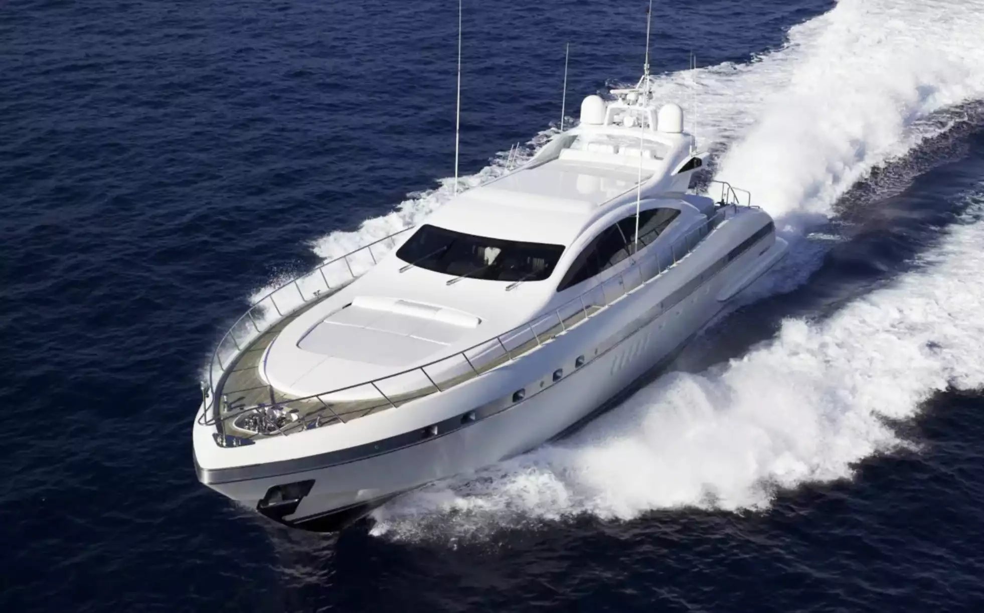 White yacht speeding across the ocean