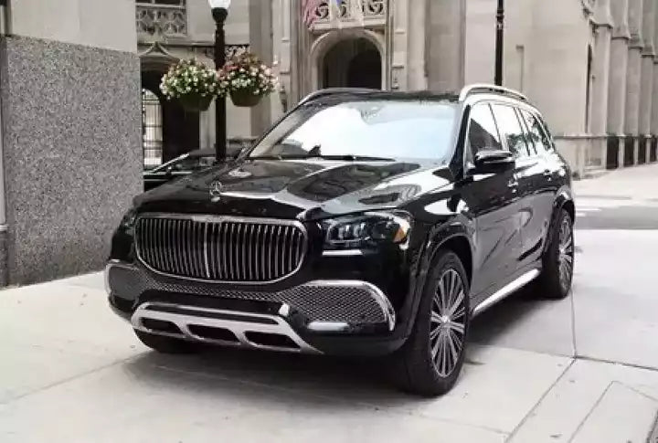 Black luxury SUV parked on a city street