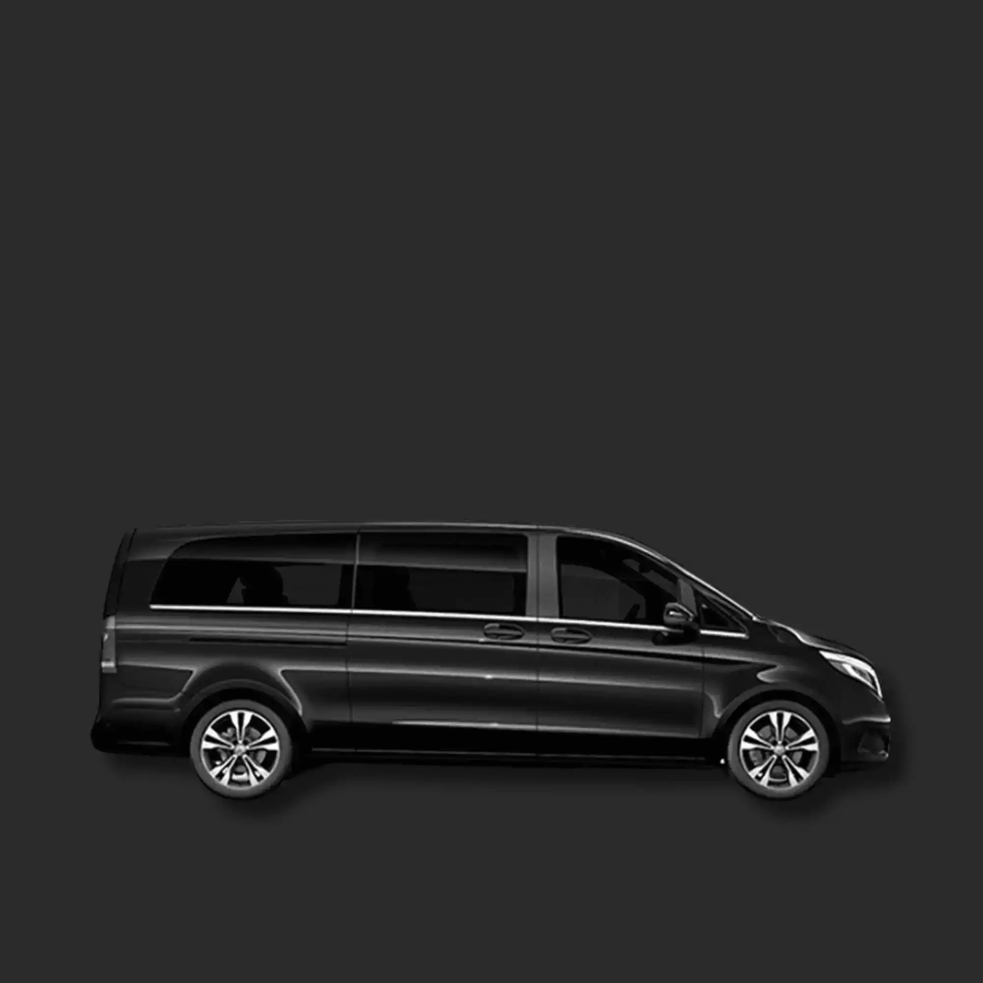Black minivan on a dark gray background