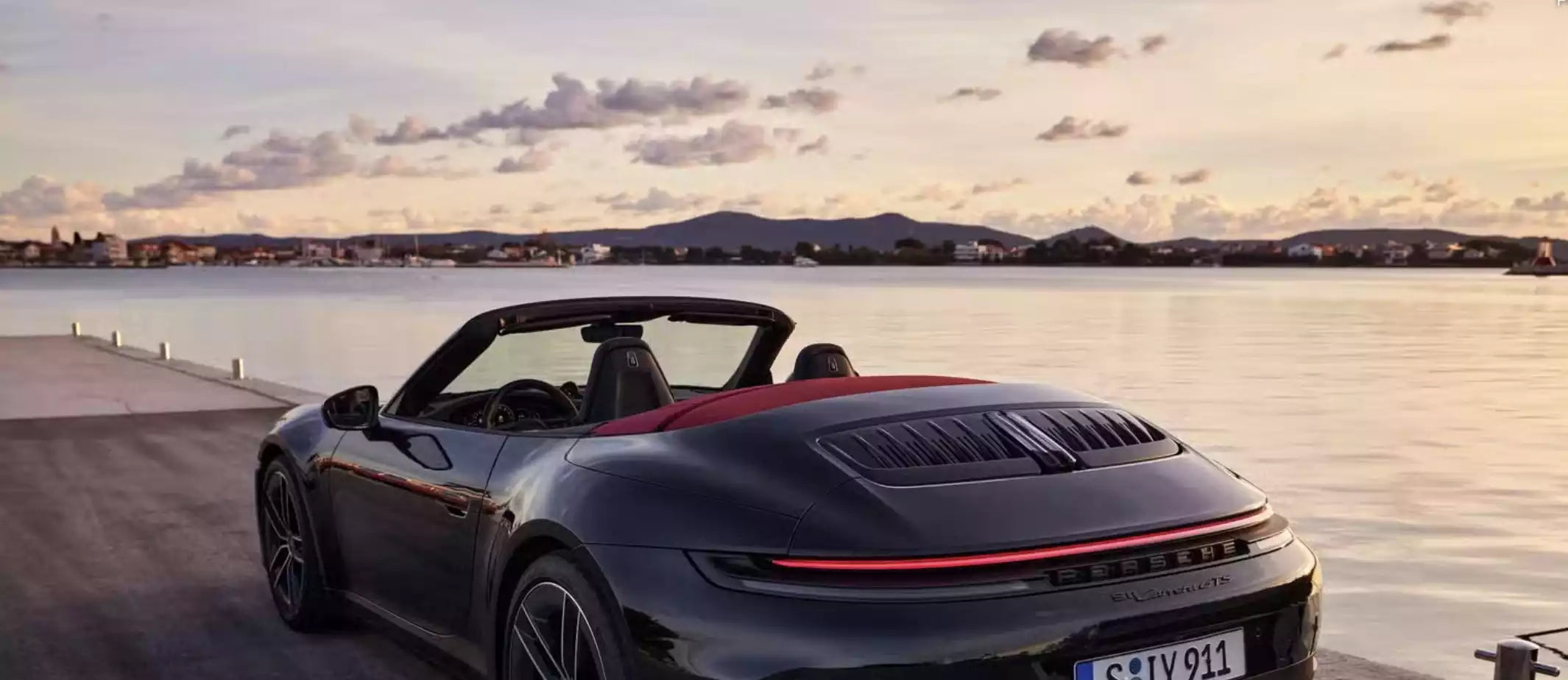 black porsche 911 in sunset