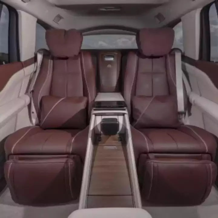 Luxury vehicle interior with brown leather seats and a center console.