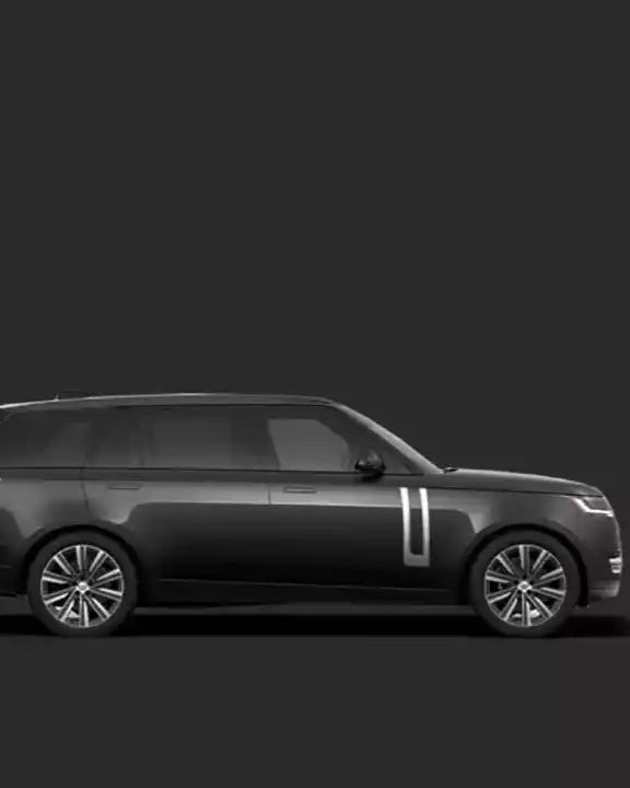 Side view of a black SUV on a dark background