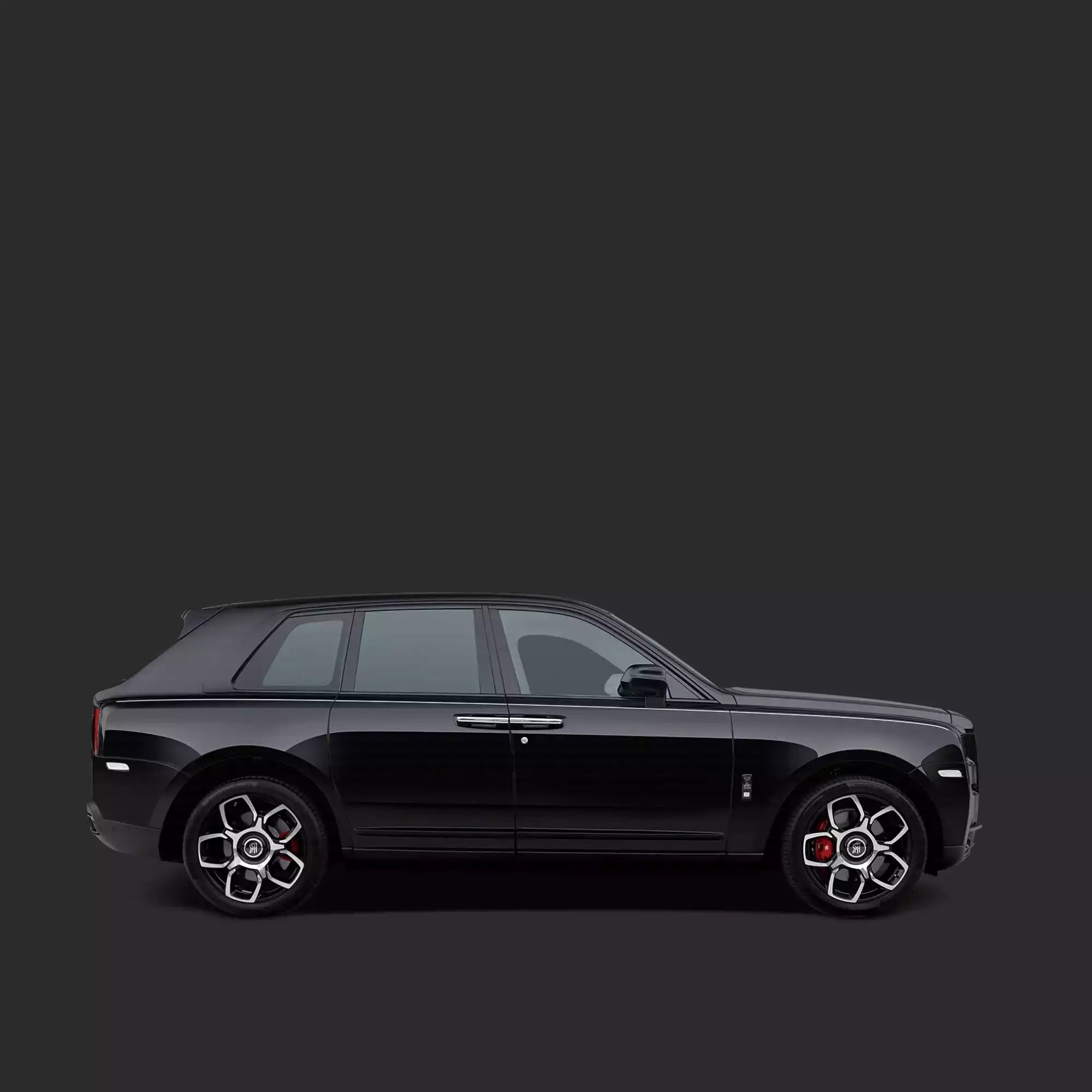 Black luxury SUV on a dark gray background