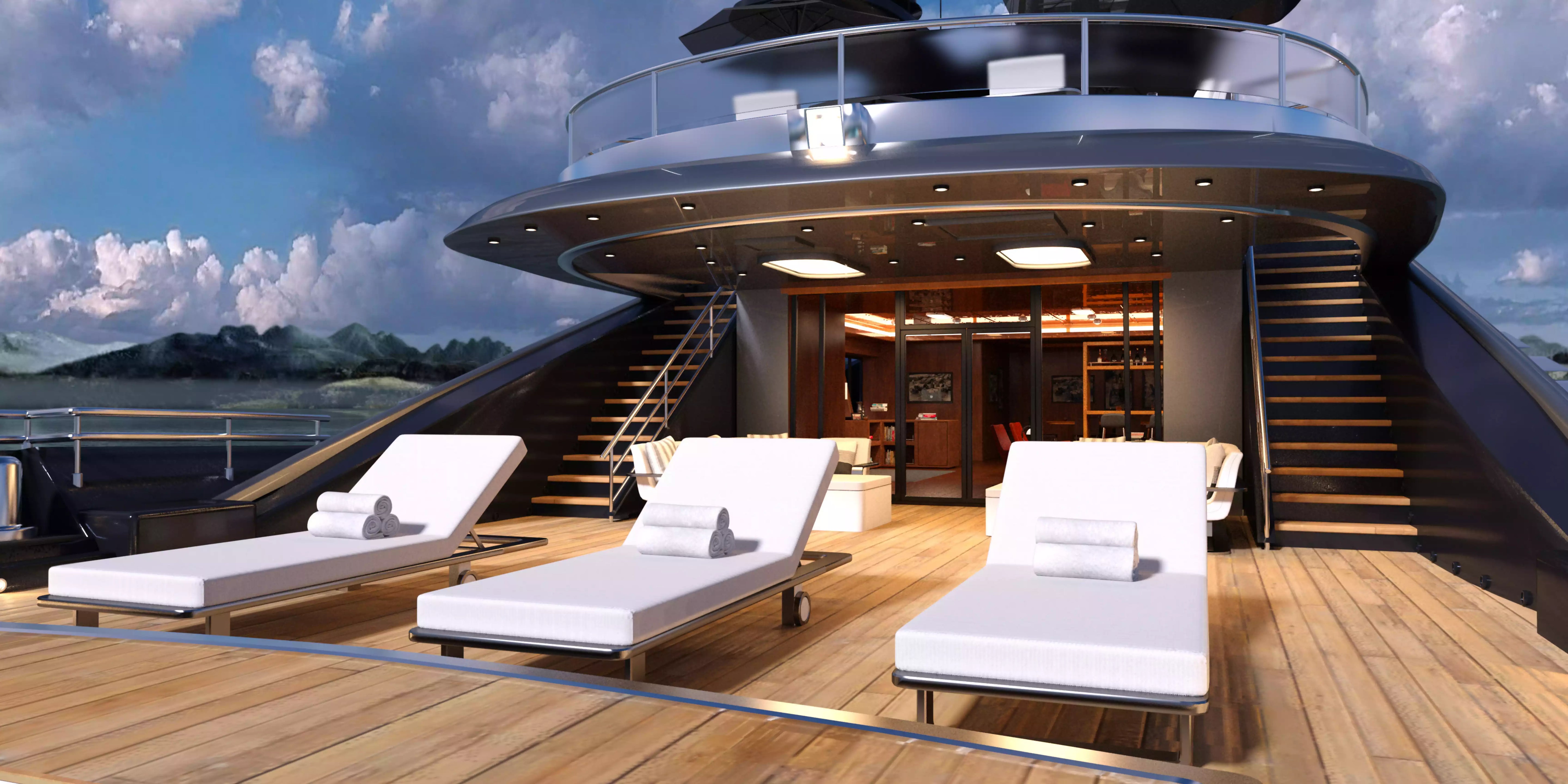 Yacht deck with lounge chairs and a view of mountains
