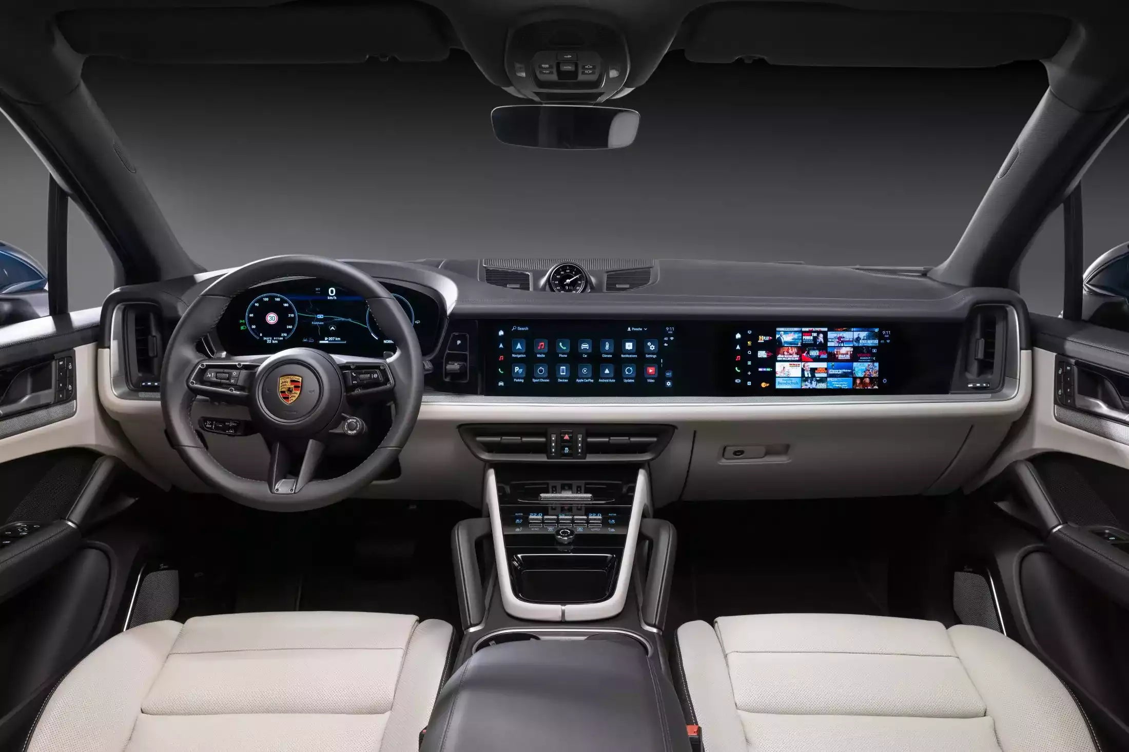 Car interior with dashboard and steering wheel featuring Porsche logo