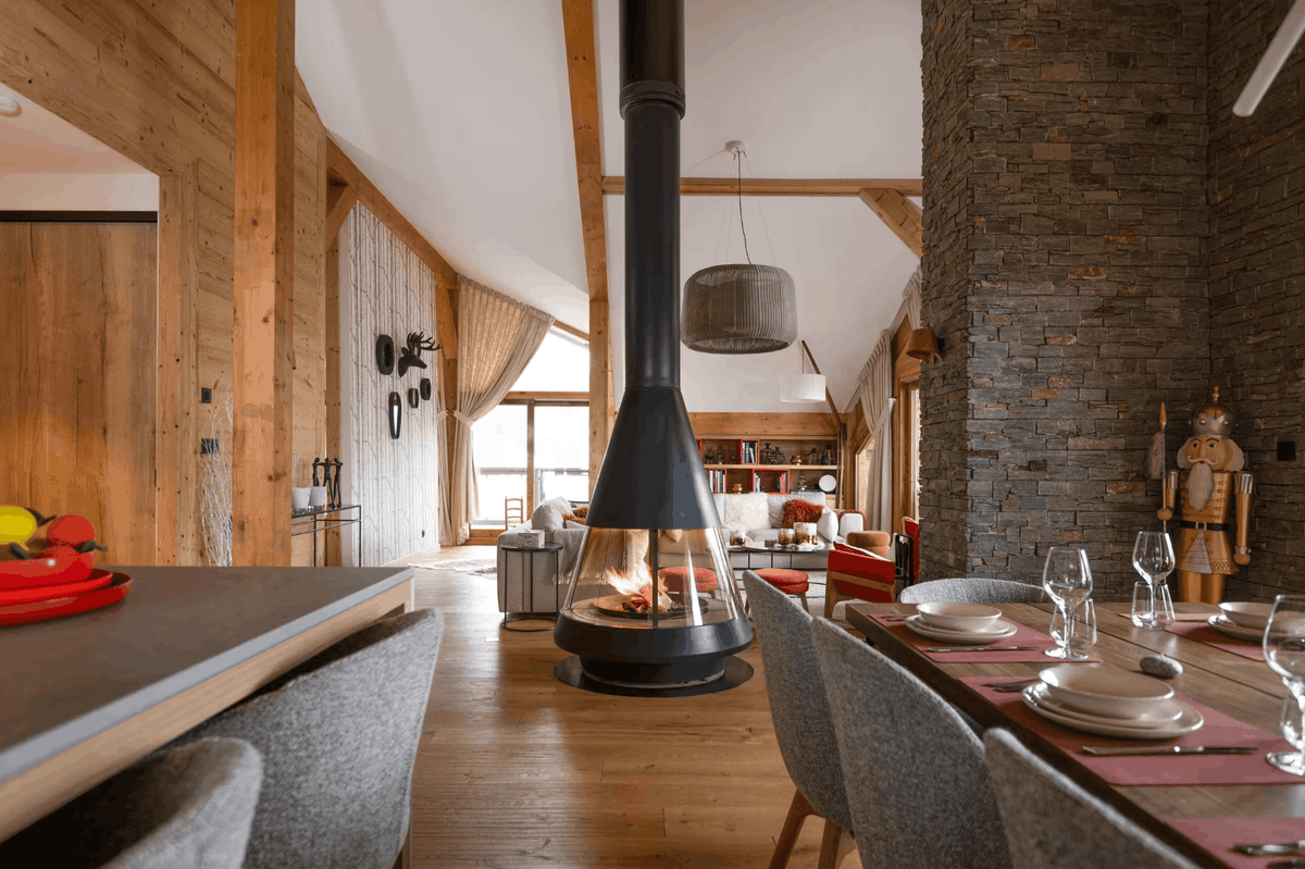 Elegant Alpine living room with fireplace at Penthouse in Courchevel
