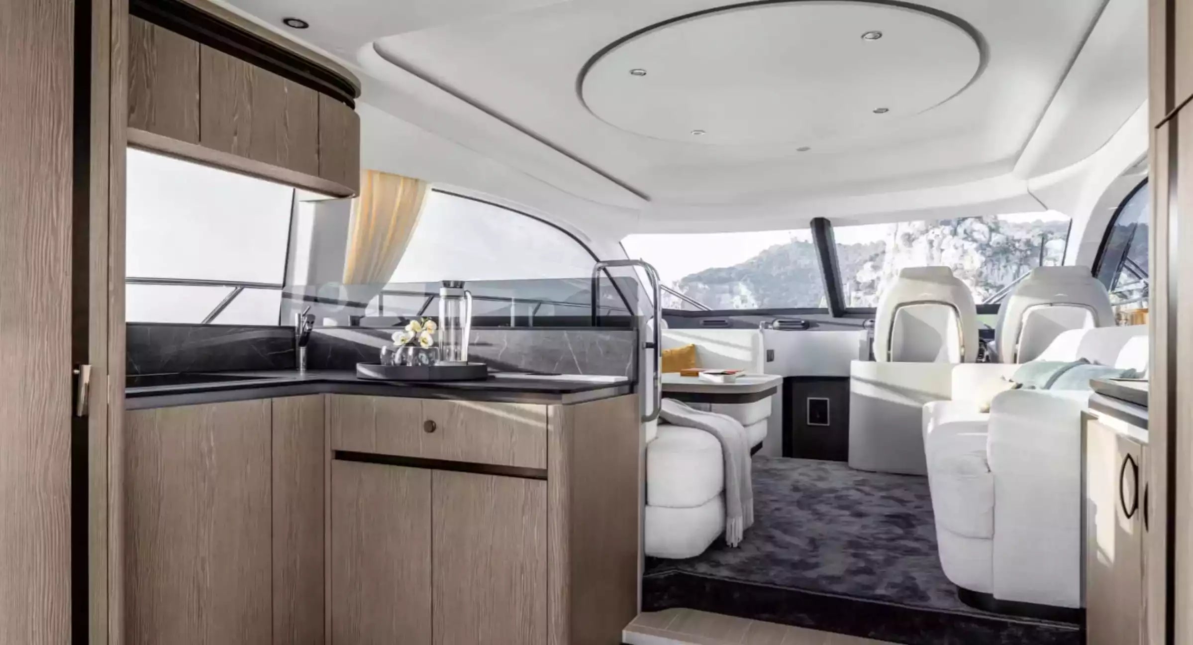 Interior of a luxury yacht with modern design and large windows.
