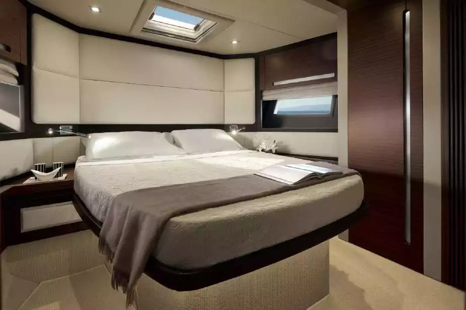 Modern bedroom interior with a large bed in a stylishly decorated room.