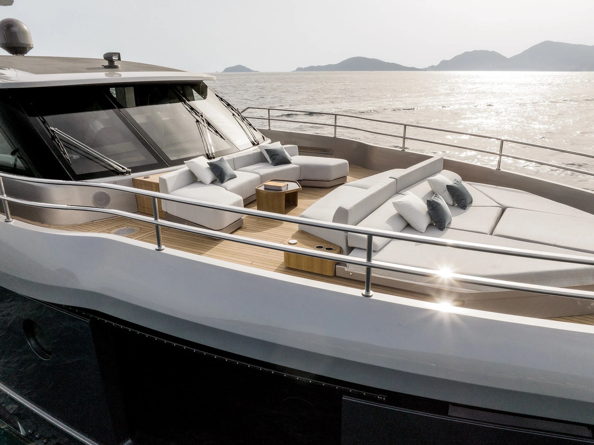 Luxury yacht deck with seating area and ocean view