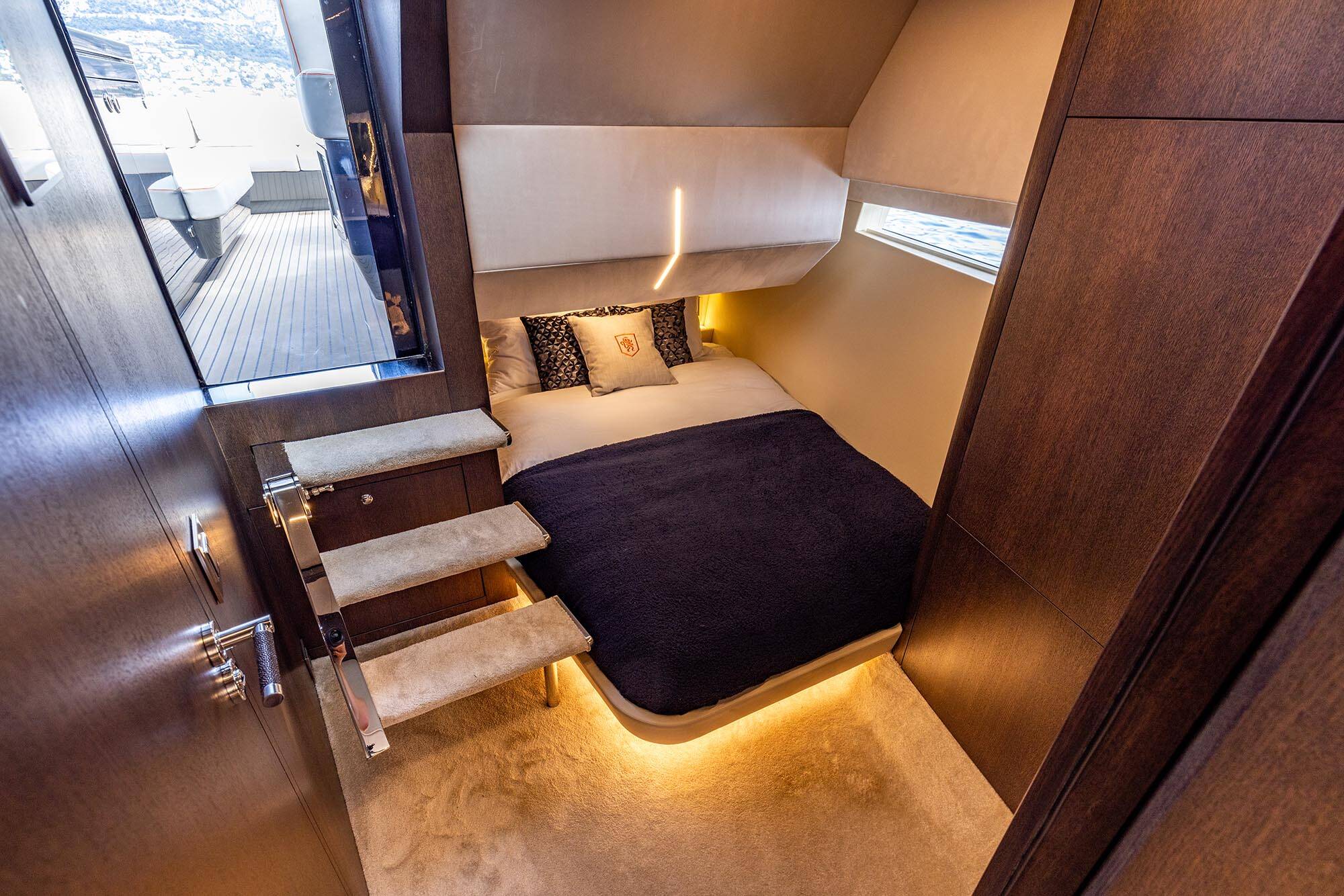Compact bedroom with a bed and small window in a compact living space