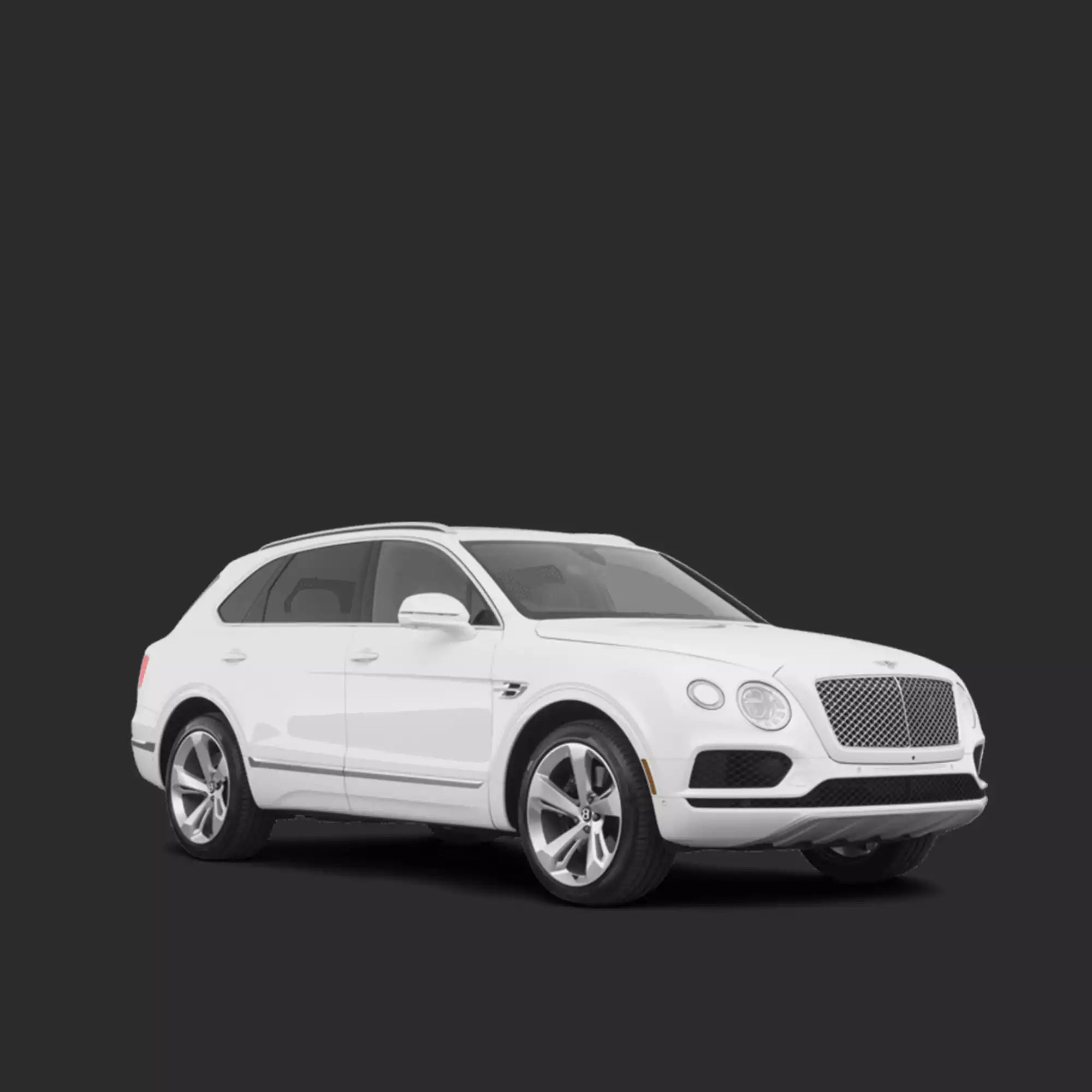 A white Bentley SUV photographed in a studio setting against a dark gray background.