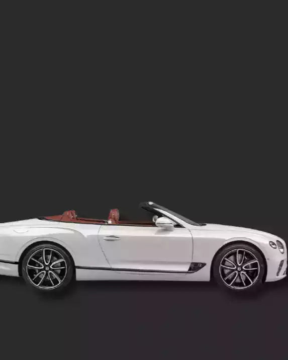 White convertible car on a black background