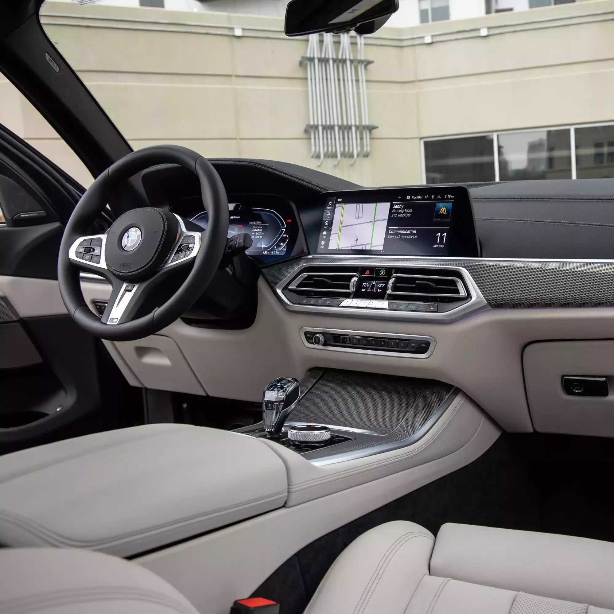 Car interior with steering wheel and dashboard in a modern setting