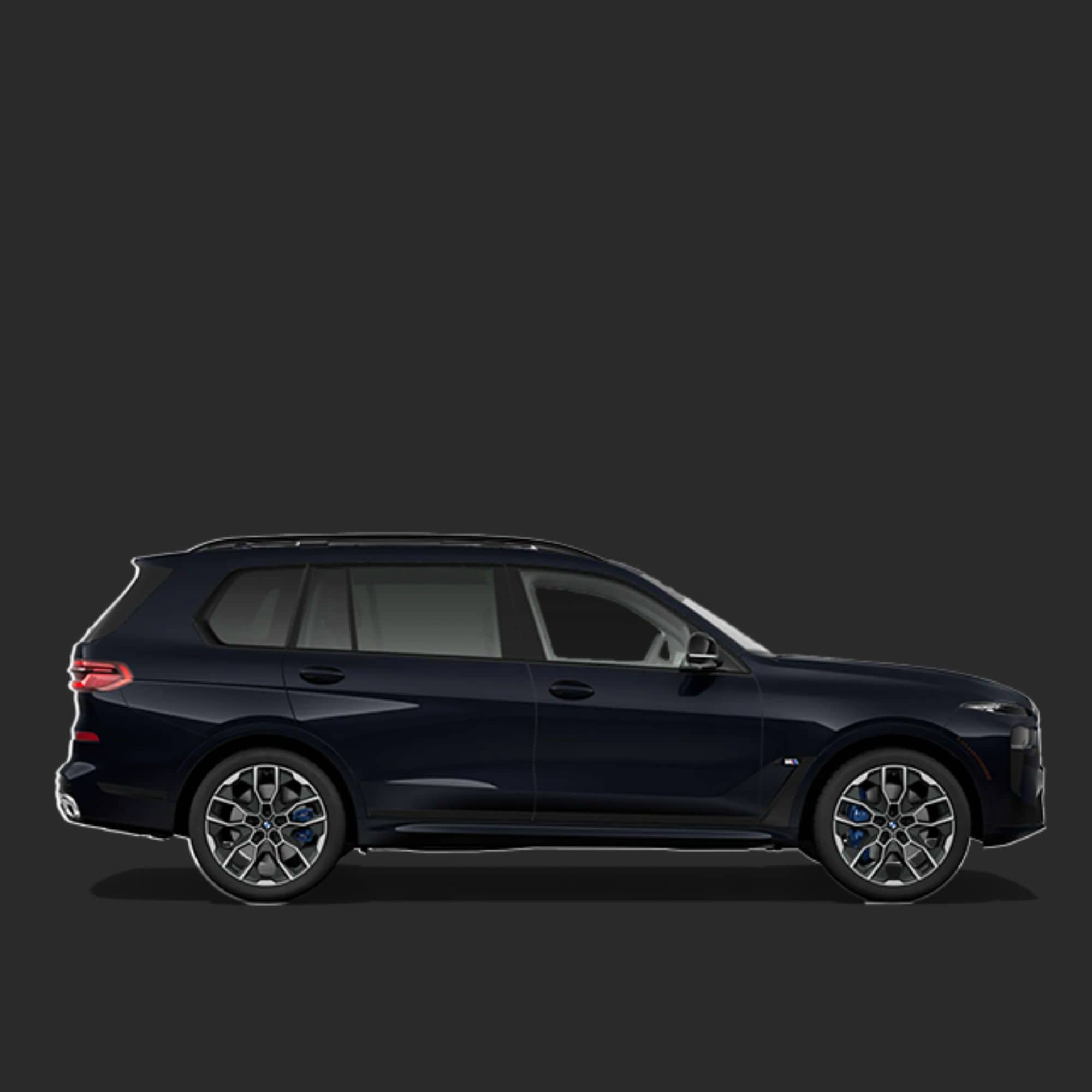 A dark navy blue BMW SUV shown in a clean side profile against a solid dark gray background.