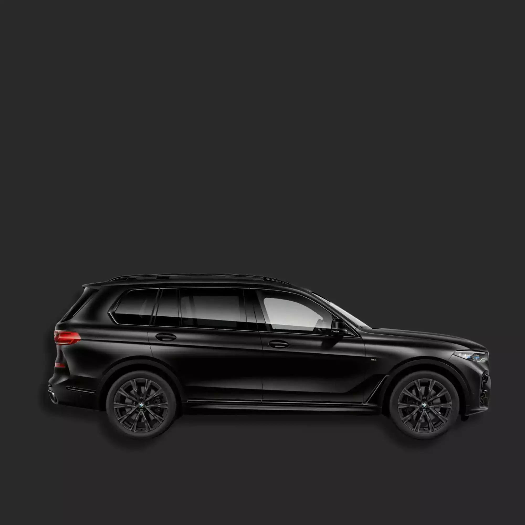 Black SUV on a dark gray background