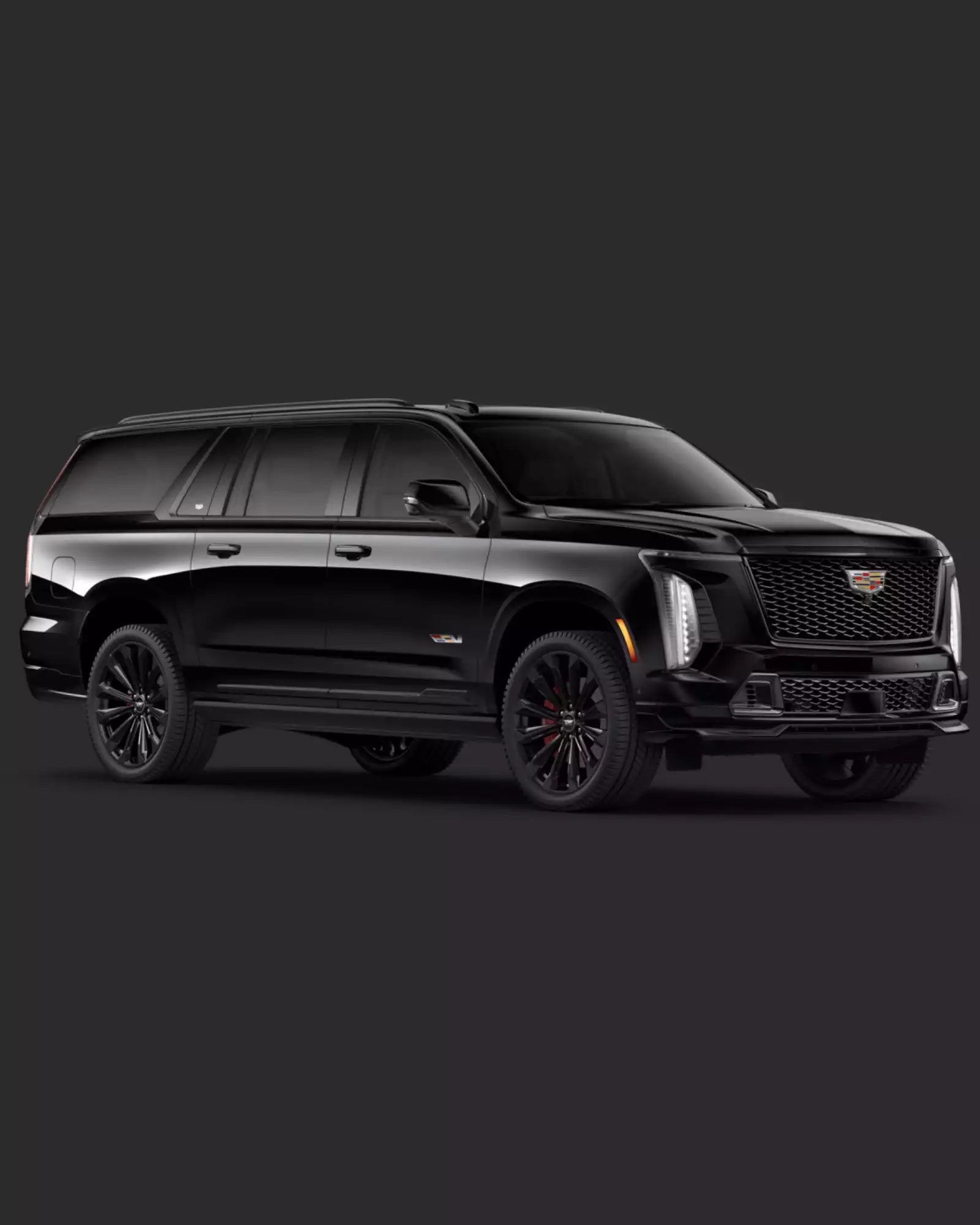 Black Cadillac SUV on a dark background