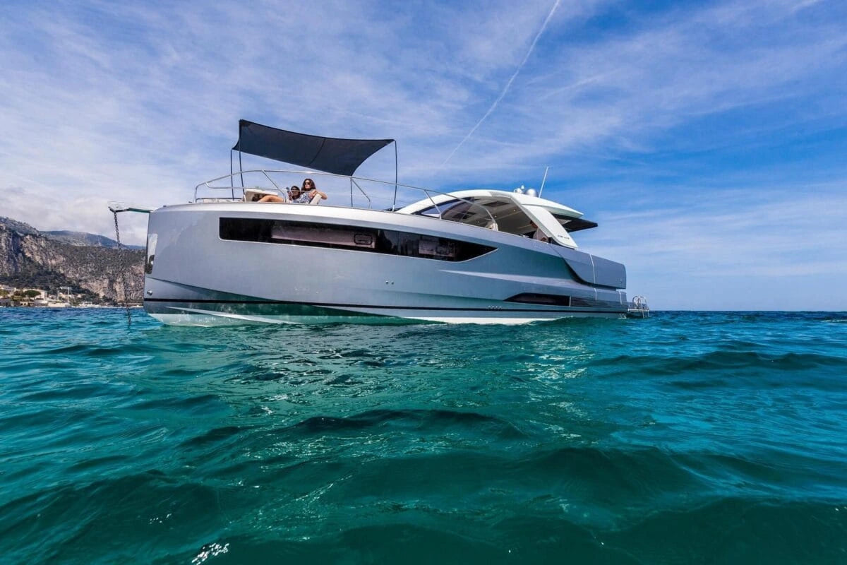 White yacht on a clear blue sea with a blue sky