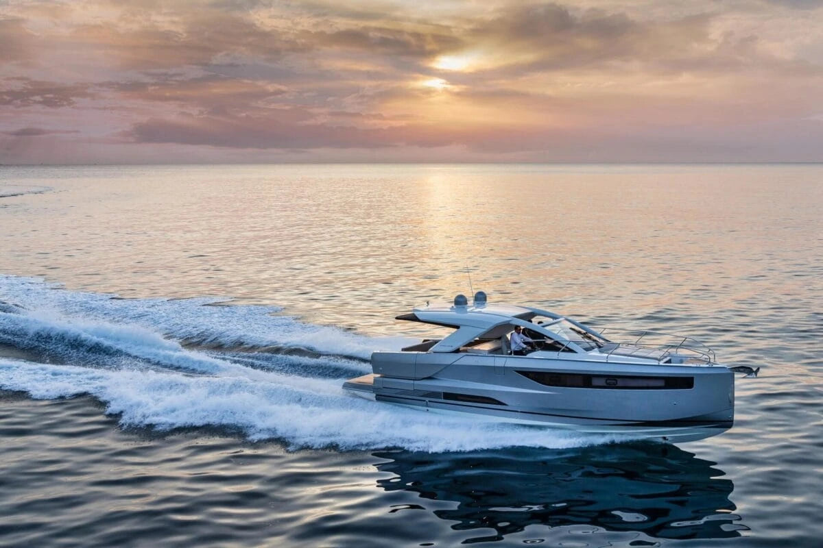 Speedboat on the water with a sunset in the background