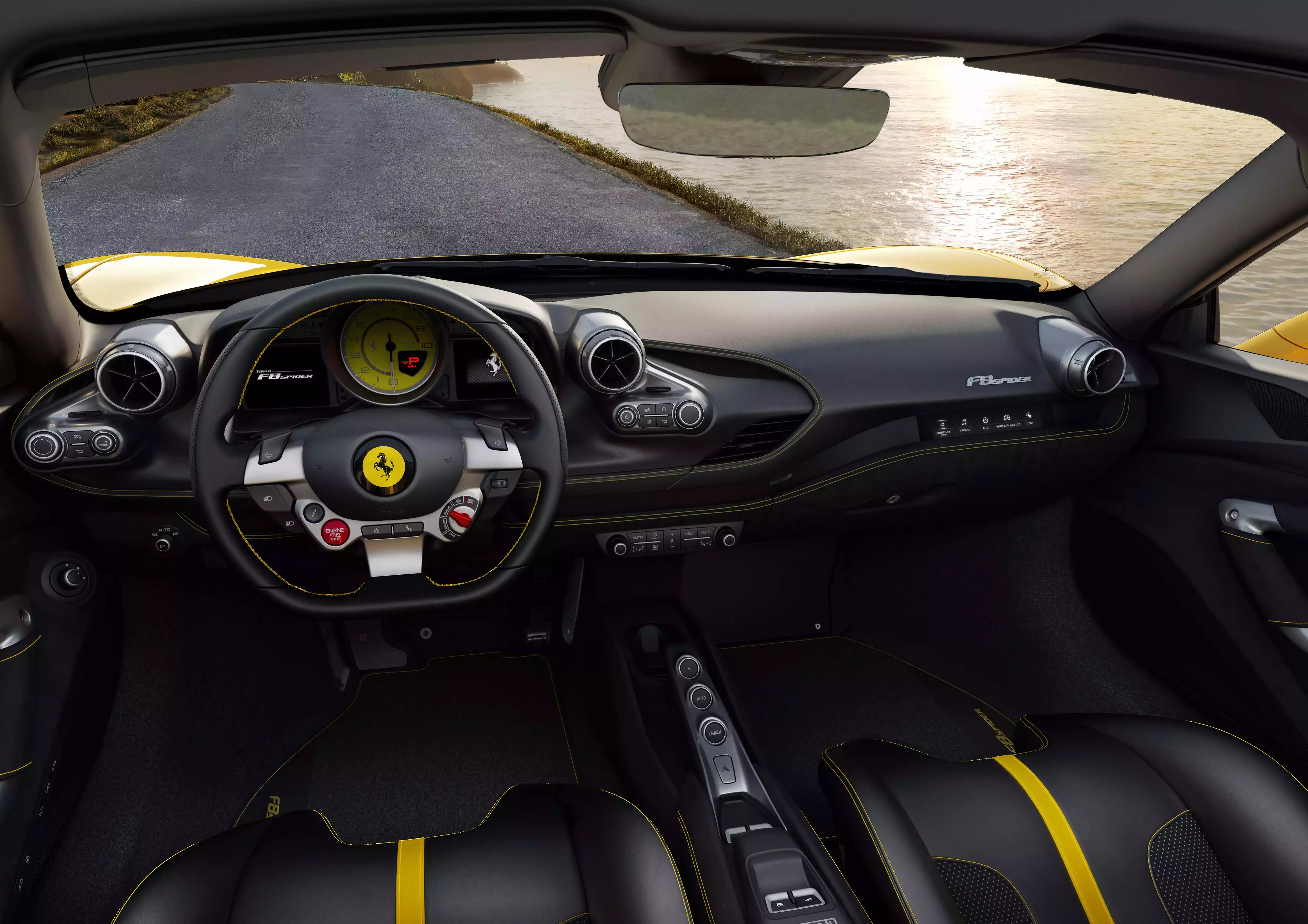 Interior of a Ferrari car with steering wheel and dashboard.