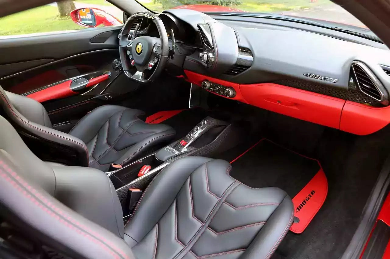 Luxury car interior with red and black accents