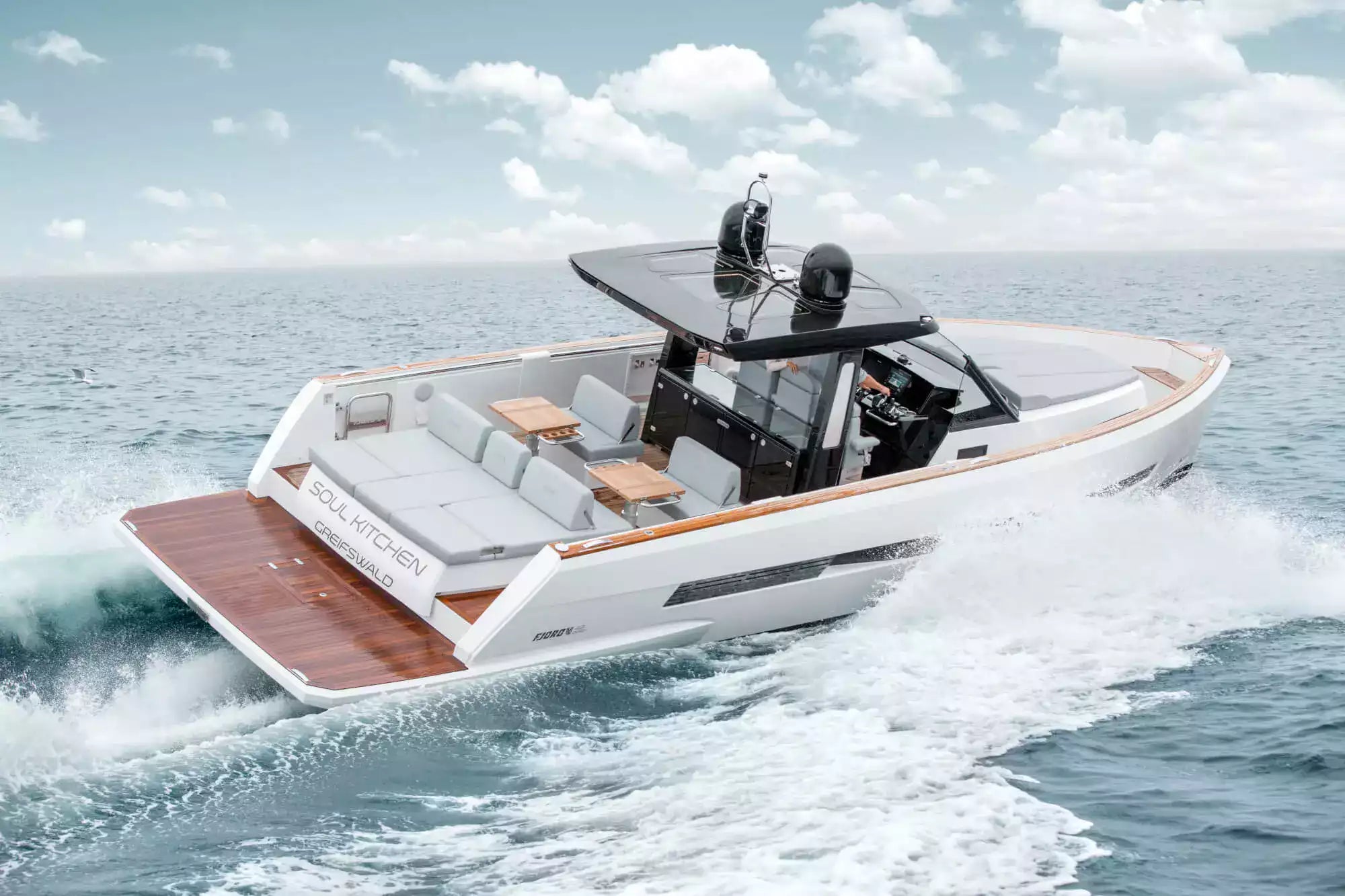 Modern electric boat on the water with a clear sky