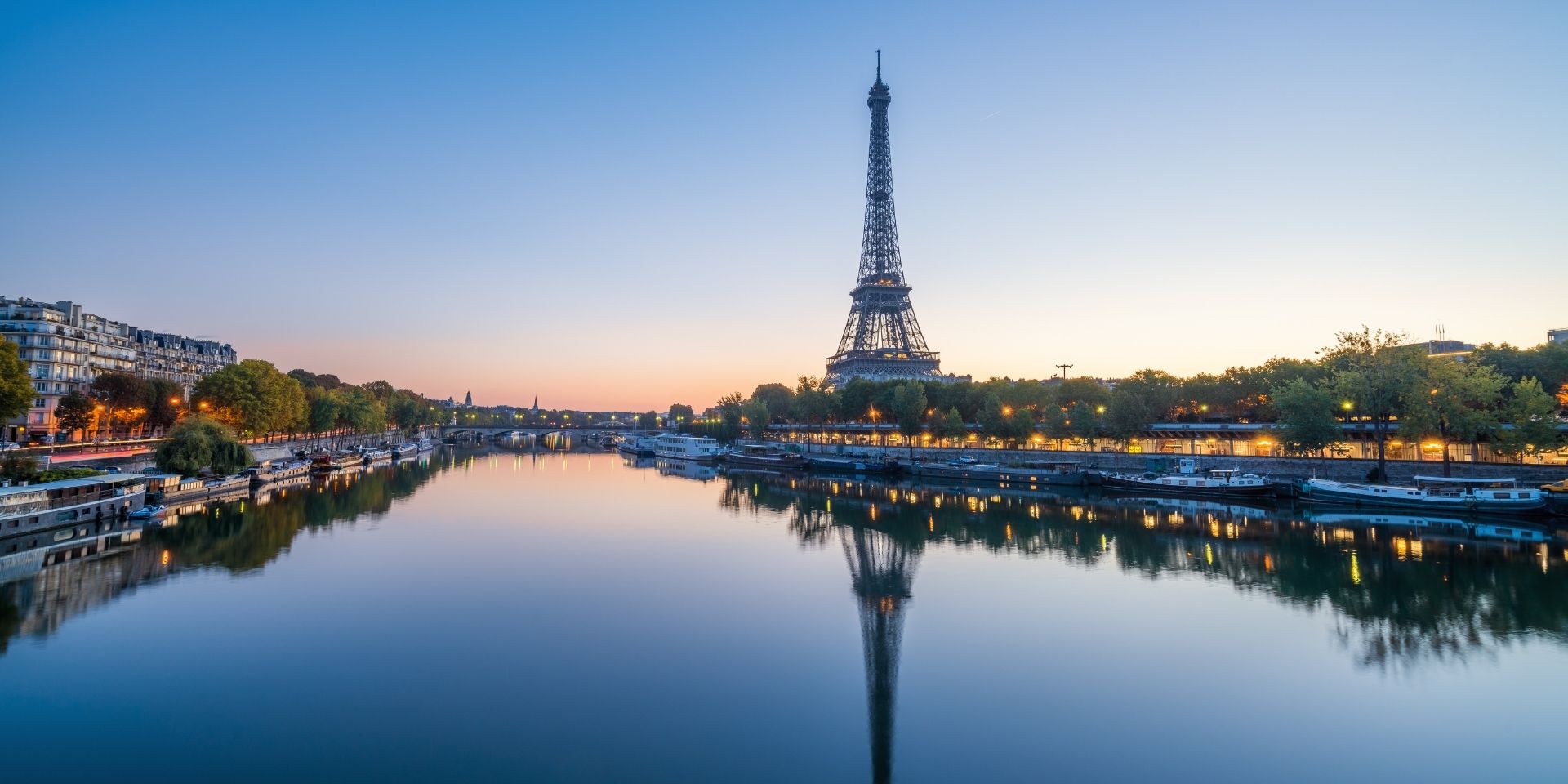 Eiffel Tower reflected in the Seine River at dusk, Paris