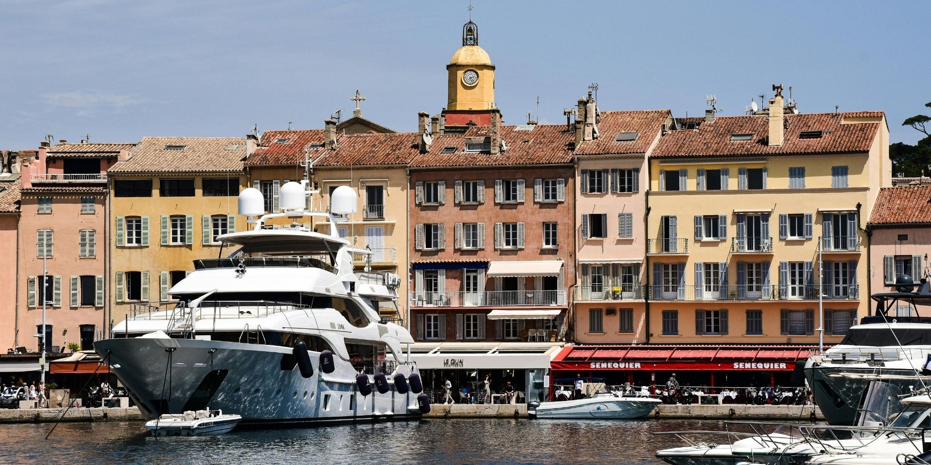 Harbor scene with boats and buildings in a coastal town