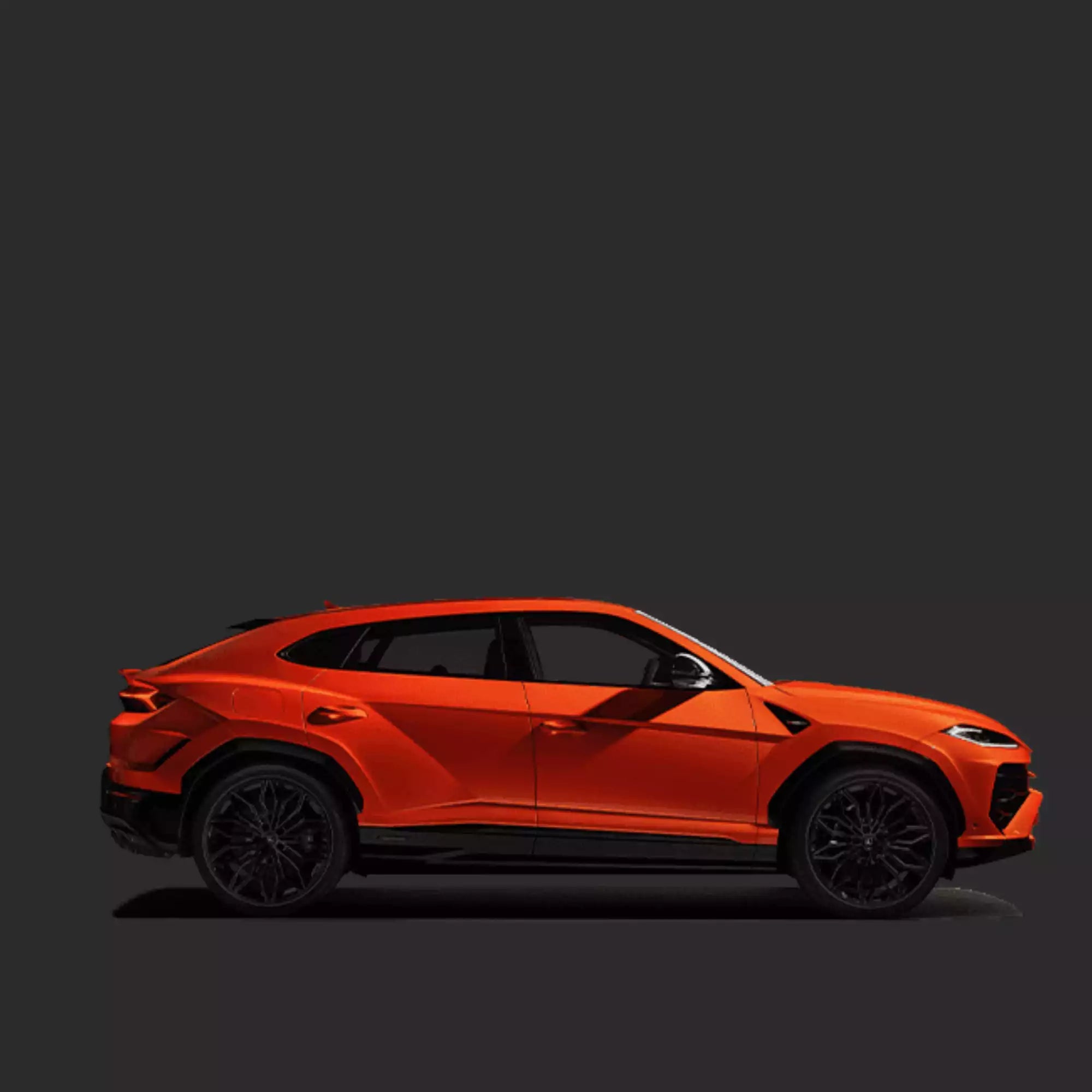Orange sports car on a dark background