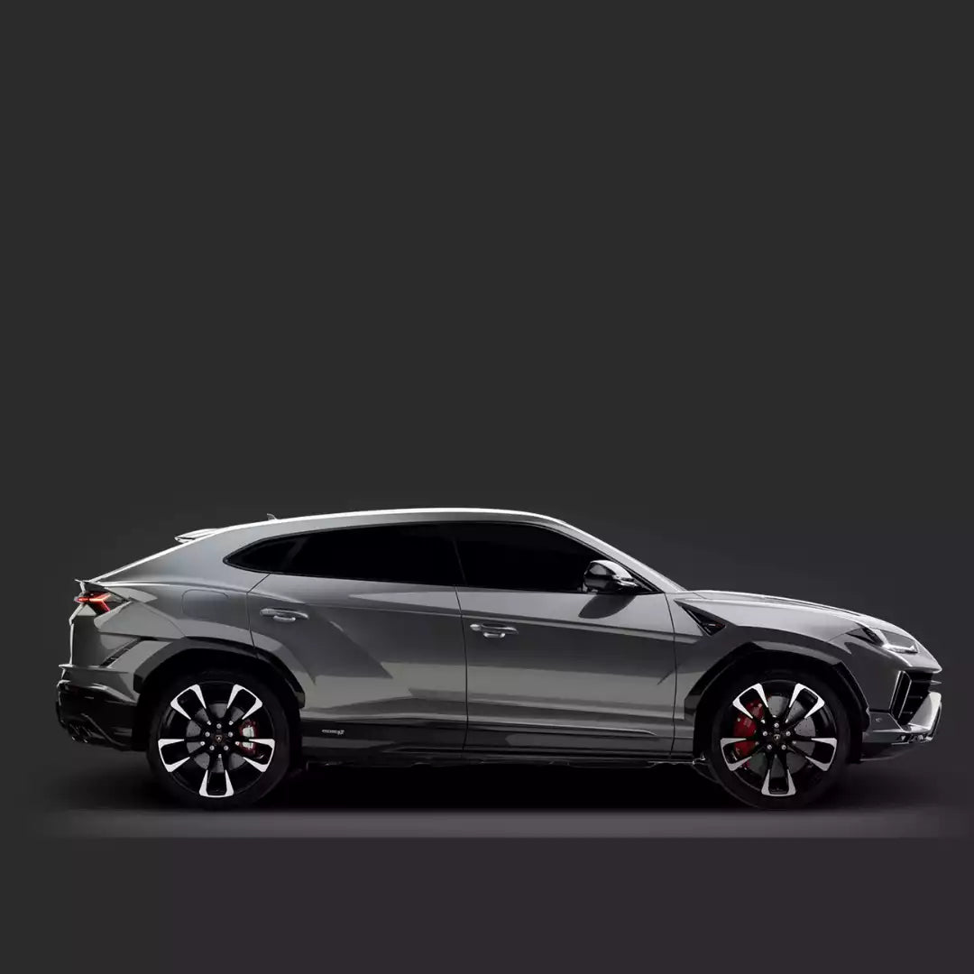 Side view of a silver SUV on a black background