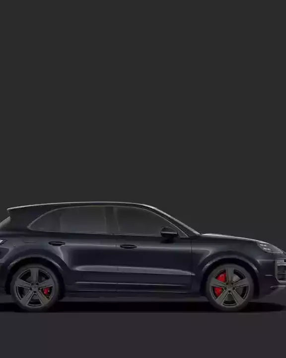 Side view of a dark-colored SUV on a black background