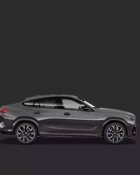 Side view of a gray car on a black background