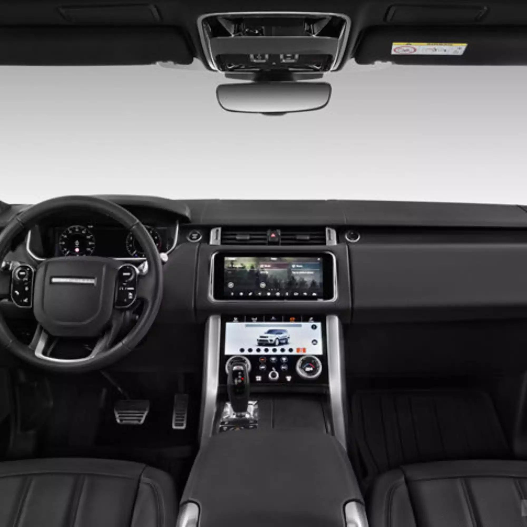 Car interior with dashboard, steering wheel, and touchscreen display.