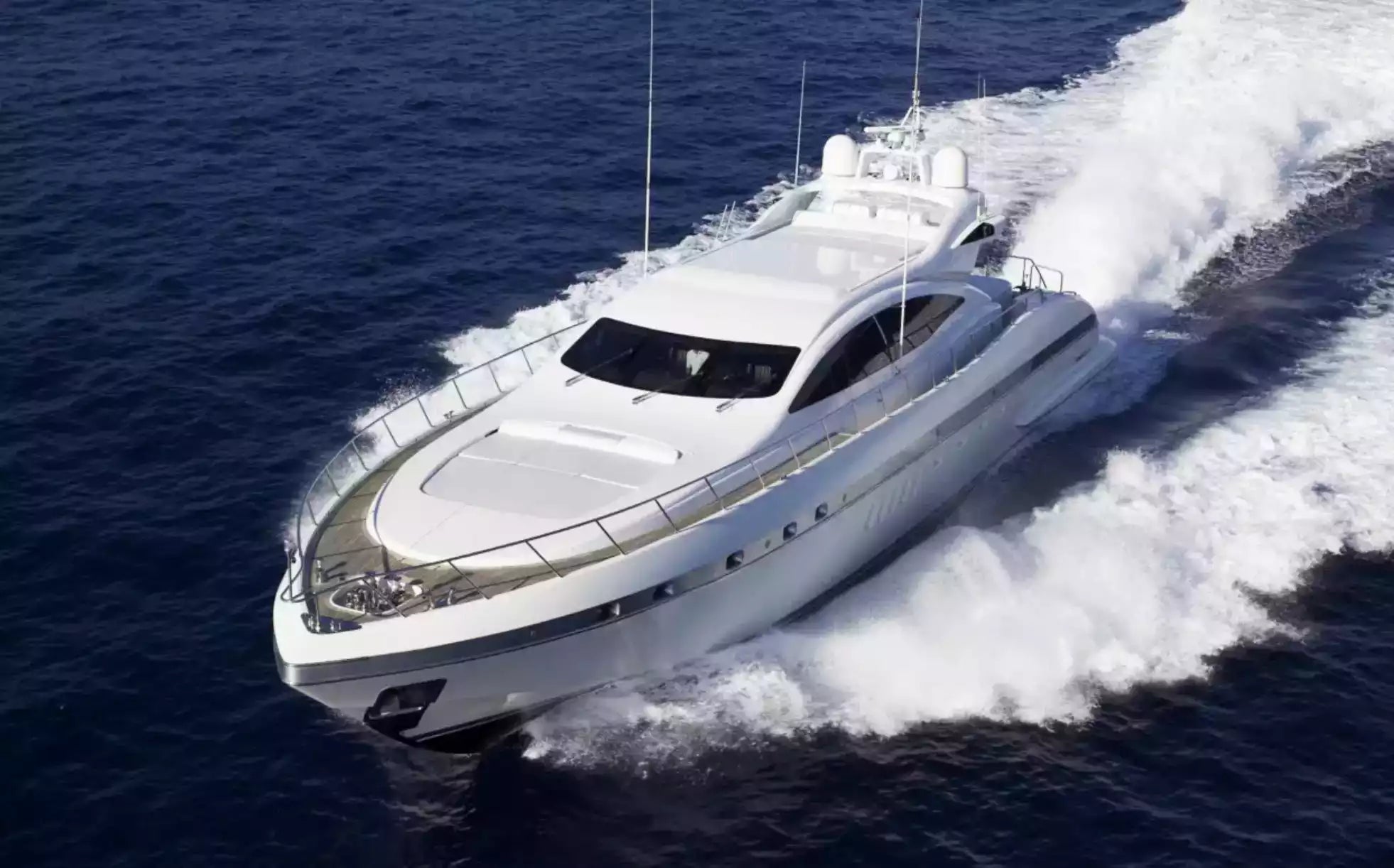 White yacht speeding on the ocean