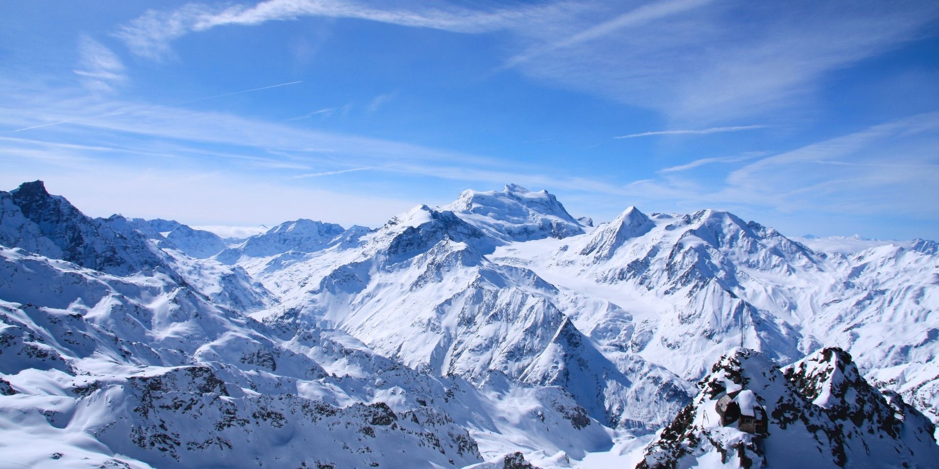 Snowy mountain landscape with clear blue sky
