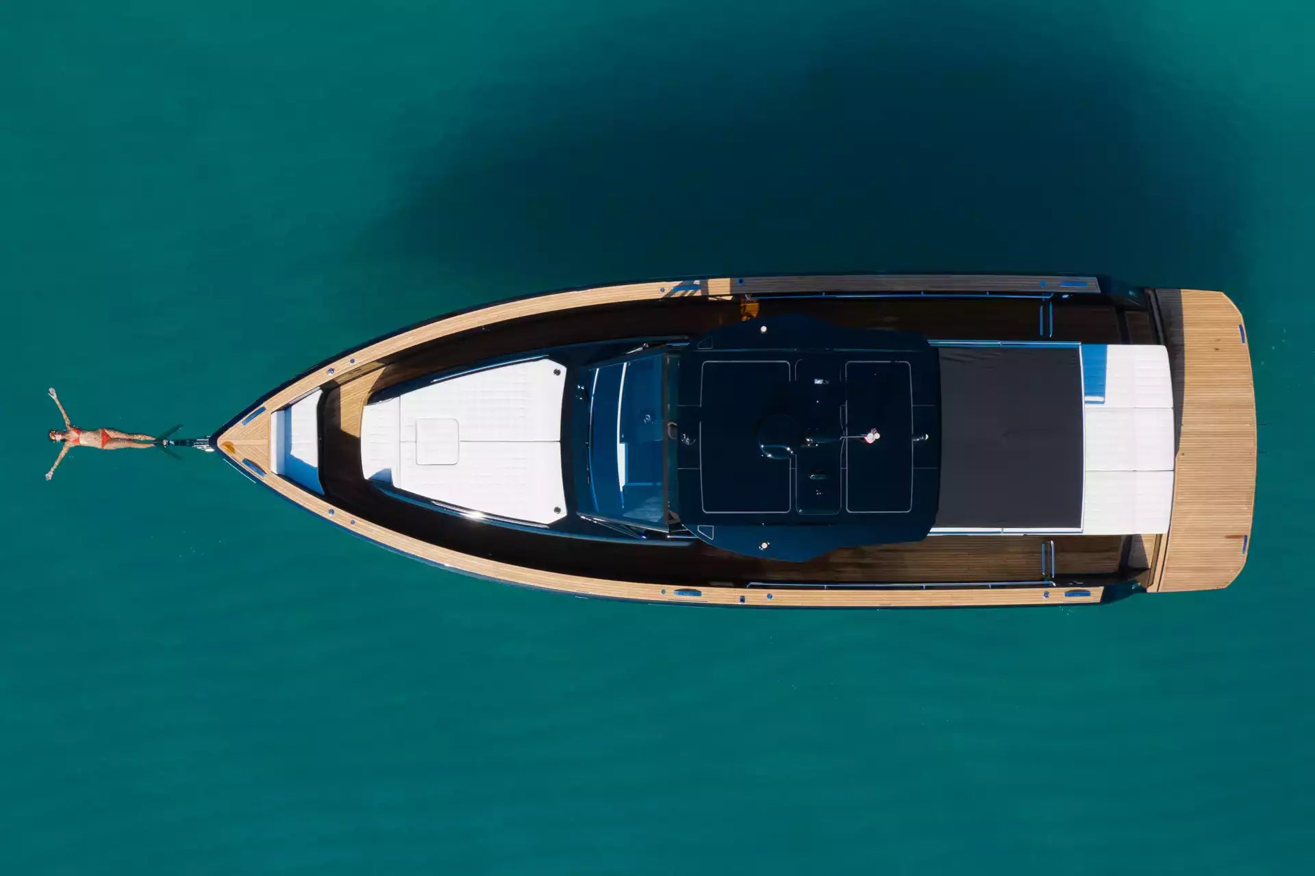Top-down view of a boat on clear blue water