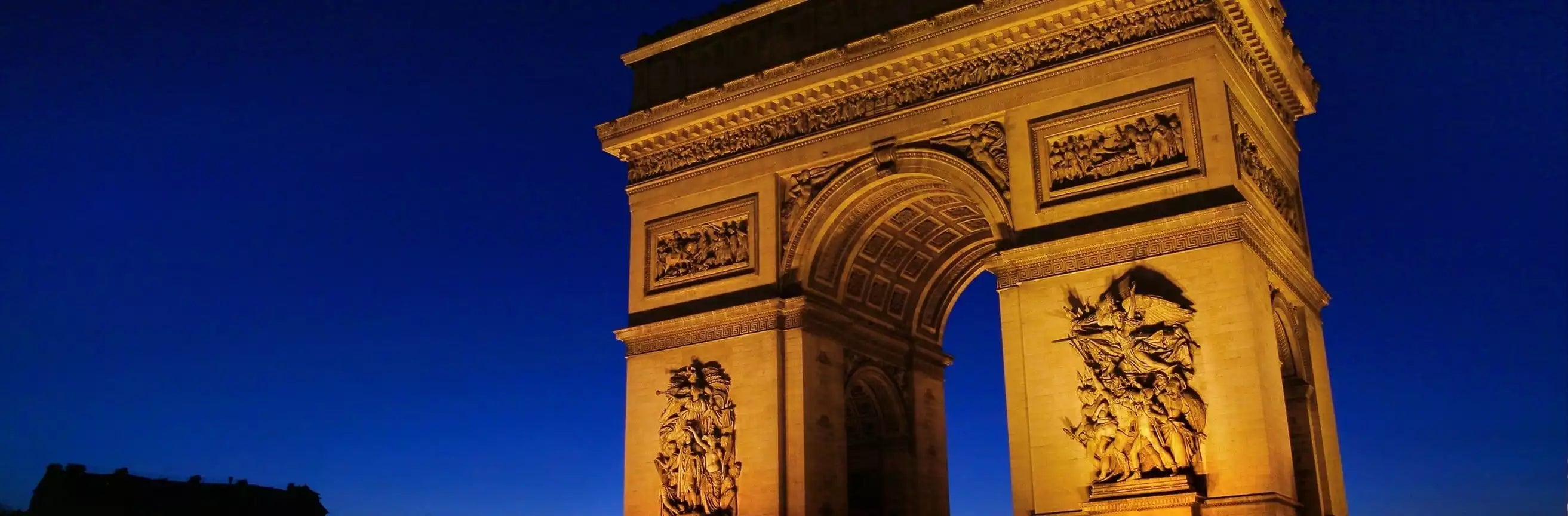Architectural landmark with intricate details against a dark blue sky