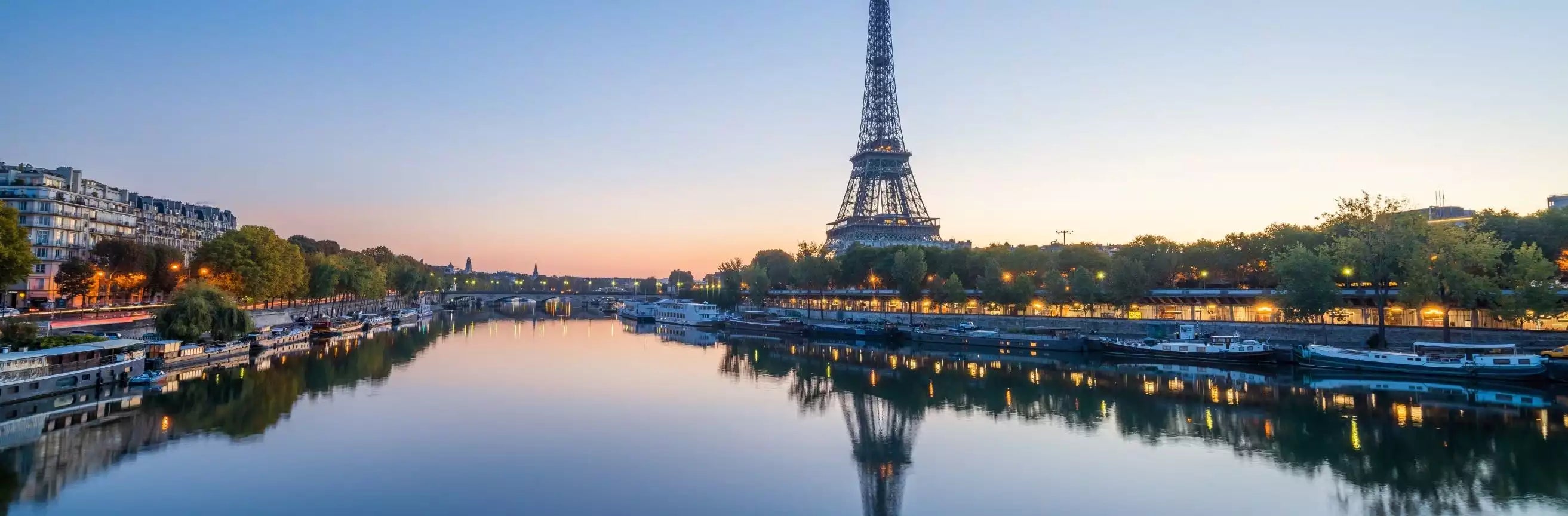 Eiffel Tower reflected in the Seine River at dusk, Paris