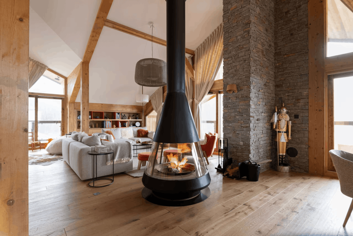Luxury living room with fireplace at Penthouse Belladone in Courchevel