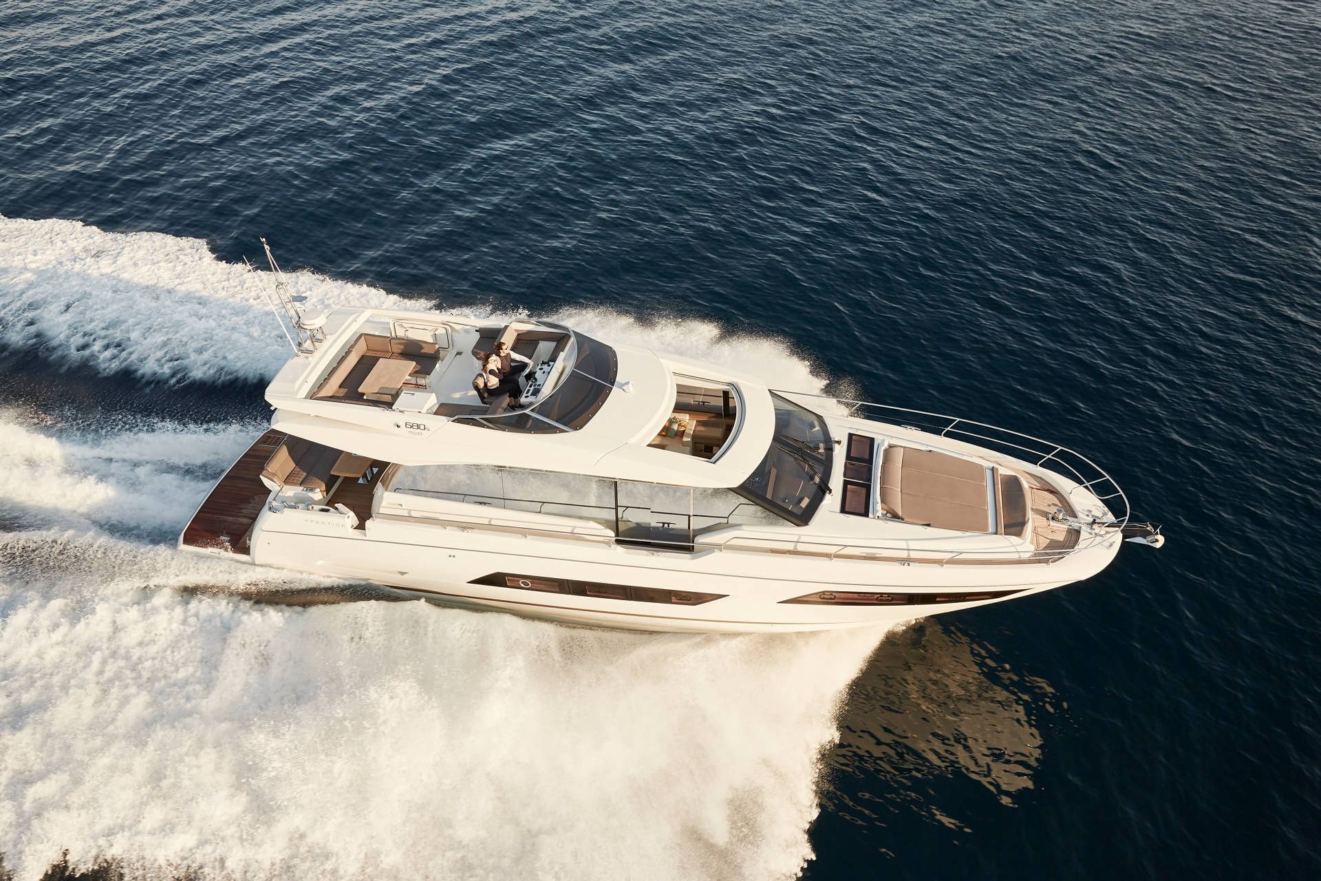 Luxury yacht speeding across a body of water