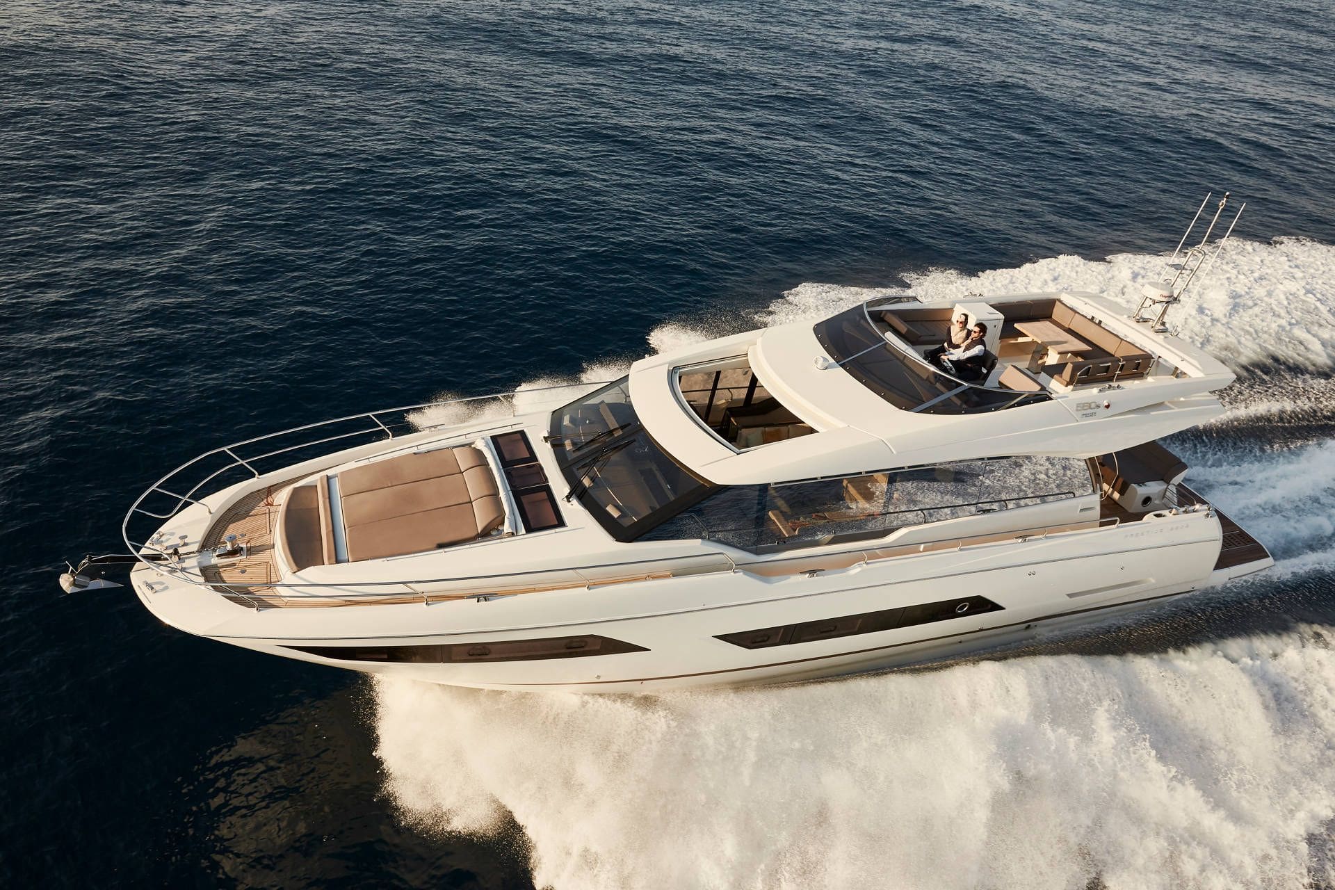 Luxury yacht speeding across the water